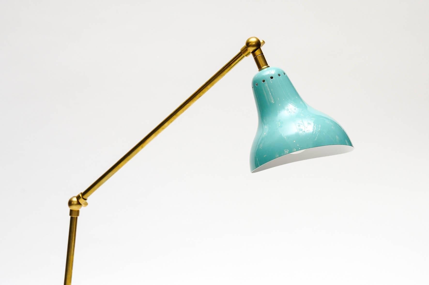 Desk lamp made of a white marble foot, brass arm articulated in three points and a teal shade.


The height indicated is when all the parts are put vertically.

 