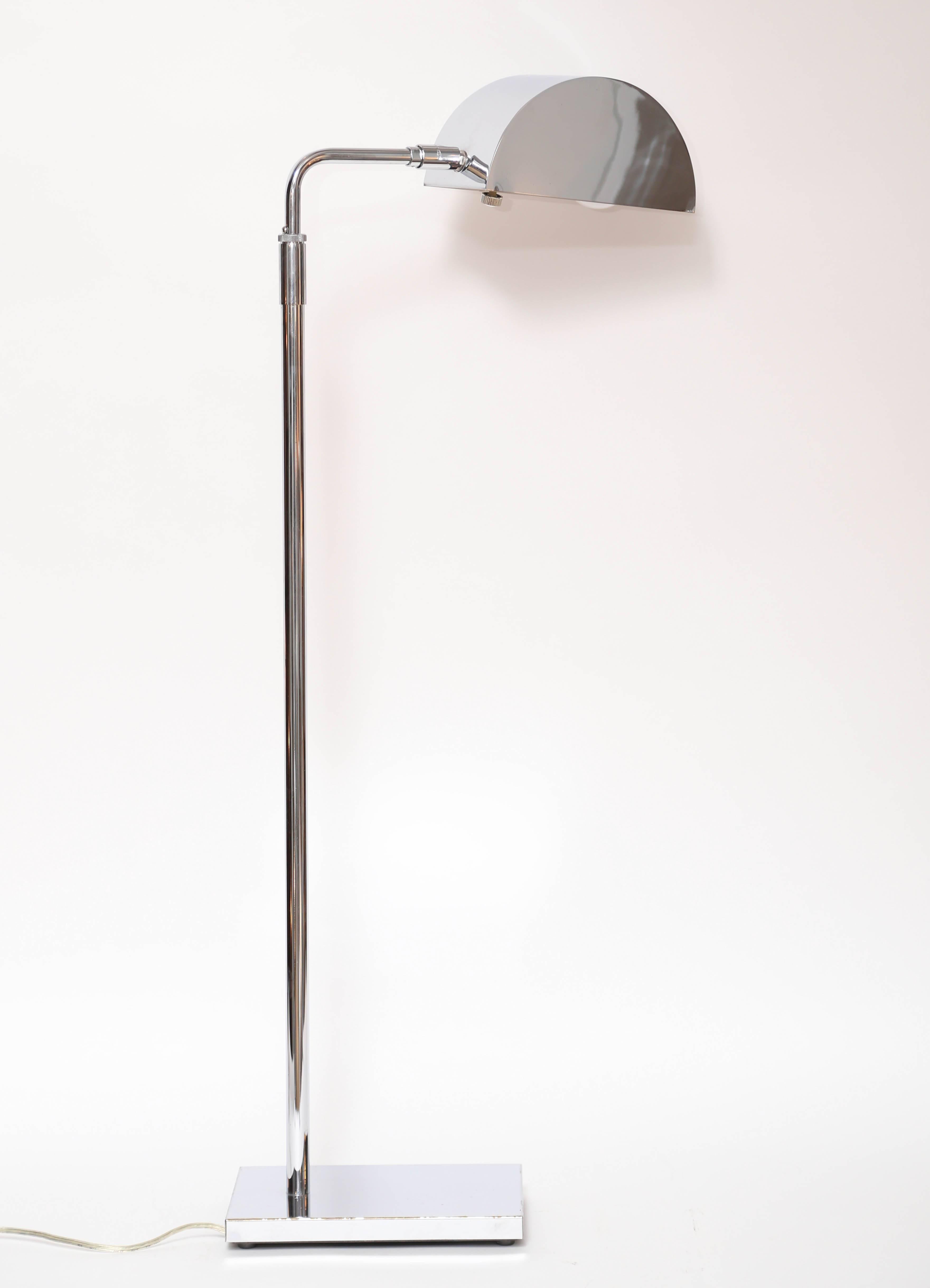 Superb chrome floor lamp by Koch & Lowy, circa 1970s. Adjustable-height steam with slim dome shade that tilts and swivels.
Measures: Base 9.25