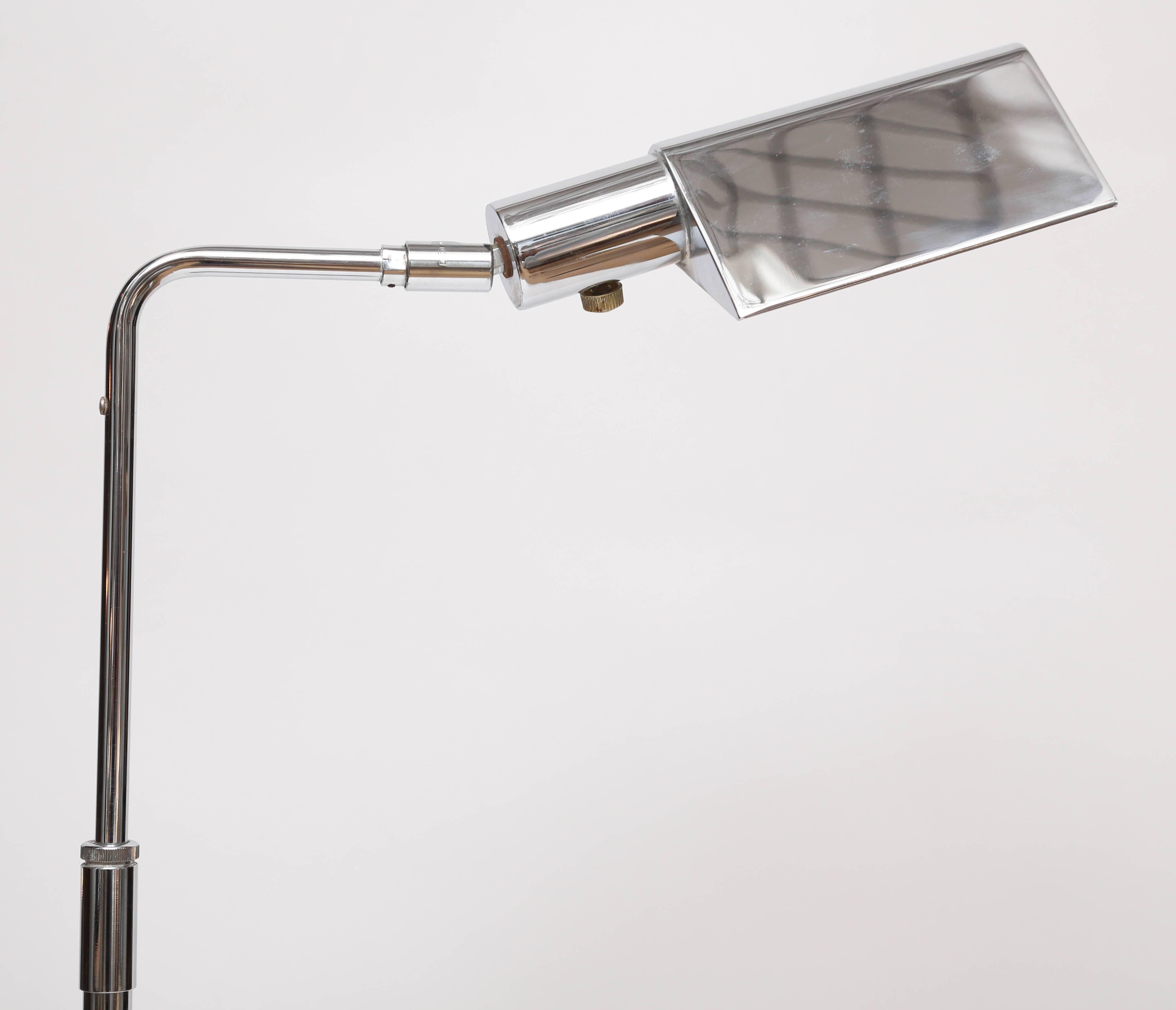 Exquisite chrome floor lamp by Koch & Lowy, circa 1970s. Adjustable height stem with tent shade that tilts and swivels. Excellent vintage condition.
Measures: Base 9.25