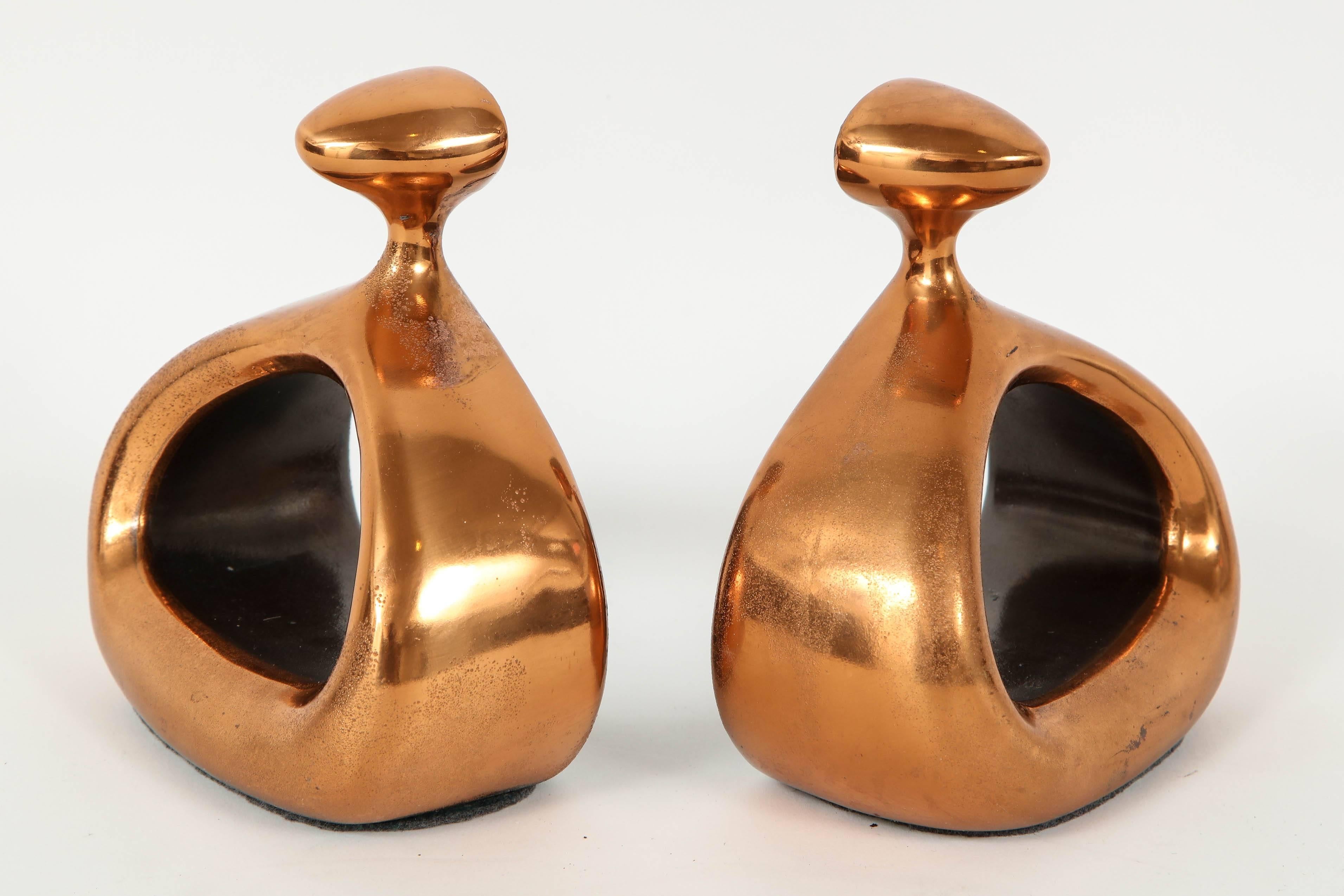 Pair of midcentury classic stirrup bookends in a copper finish. Grey felt bottoms. Labeled, Ben Seibel/Jenfredware.