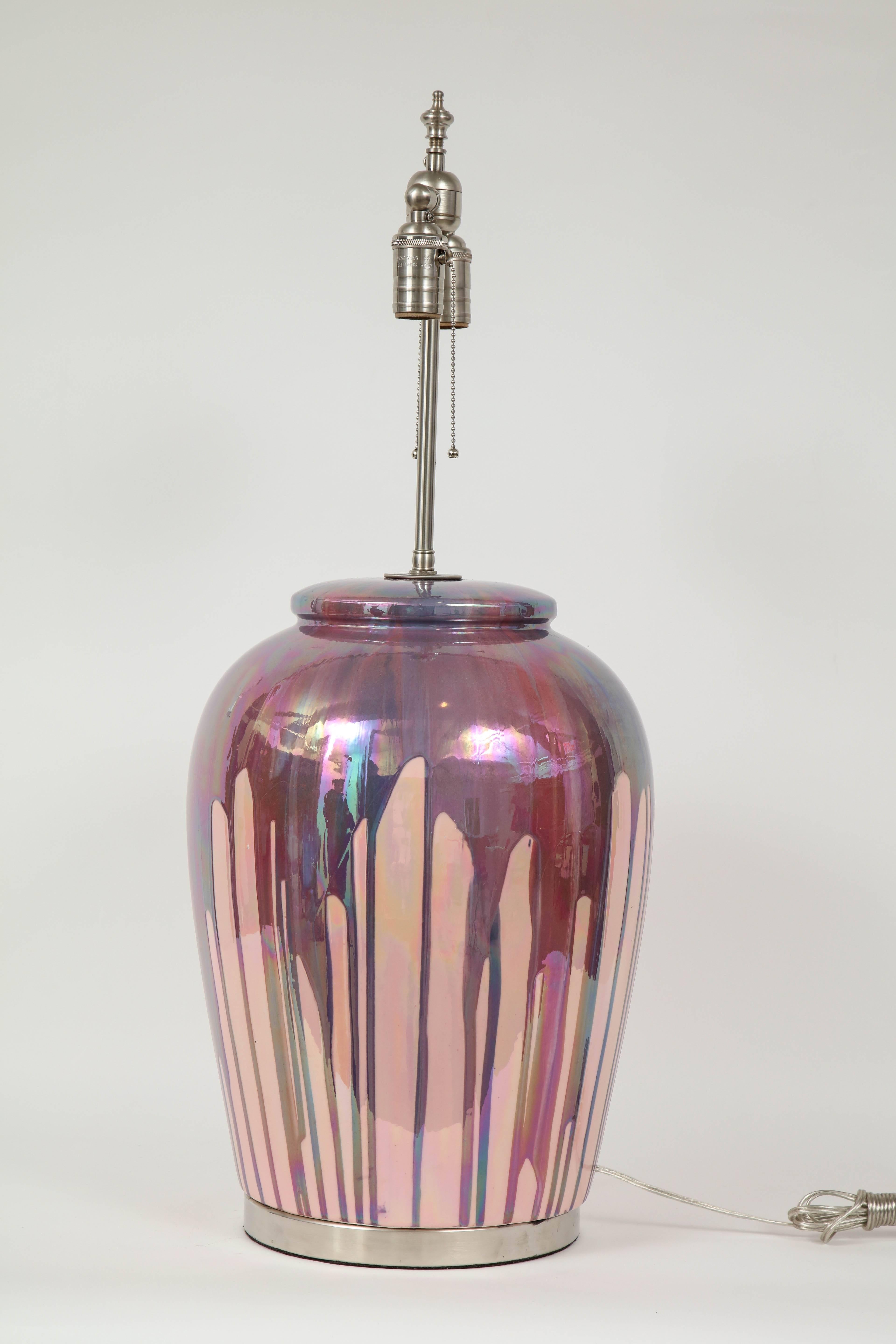 Large-scale mesmerizing midcentury Italian porcelain ceramic glazed lamps in a blush or rose color and iridescent purple or raspberry drip overglaze sitting on satin nickel bases. Rewired for use in the USA with satin nickel cluster sockets.
75W