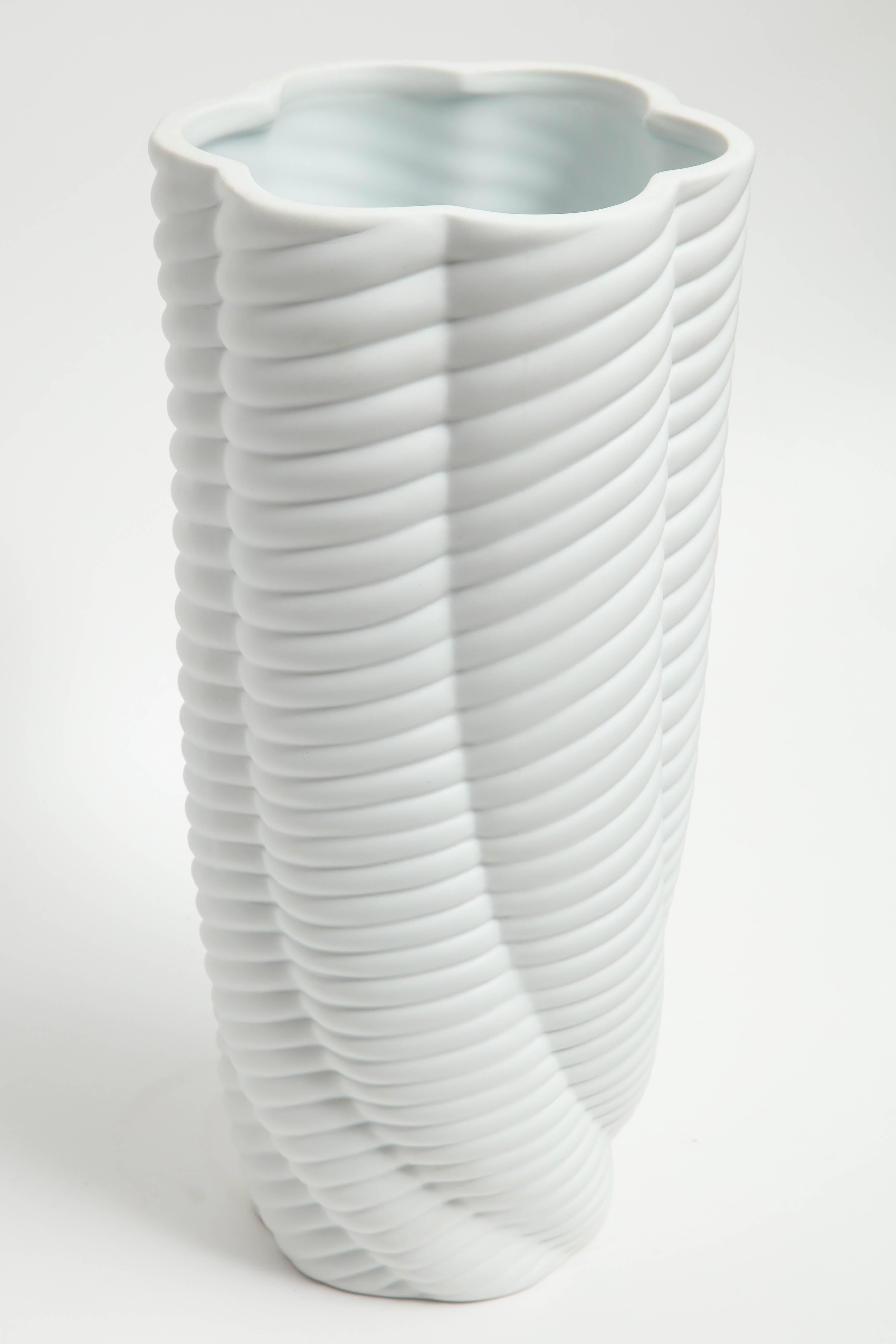 Pair of contemporary sea sponge organic form matte porcelain vases with a ripple effect.