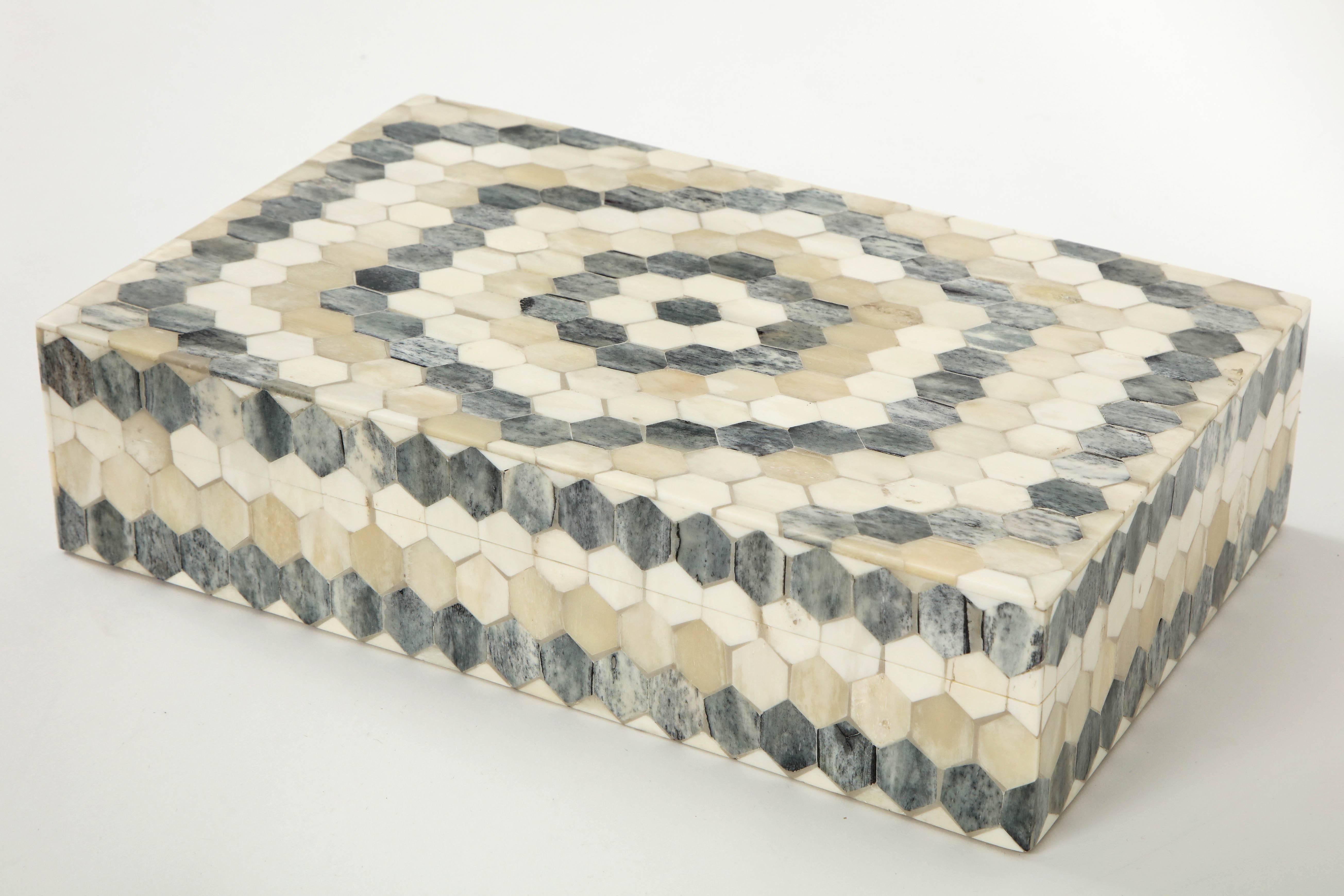 Contemporary keepsake box/remote control keeper adorned with hexagonal shaped bone tiles in grey and natural, lined in zebrawood.