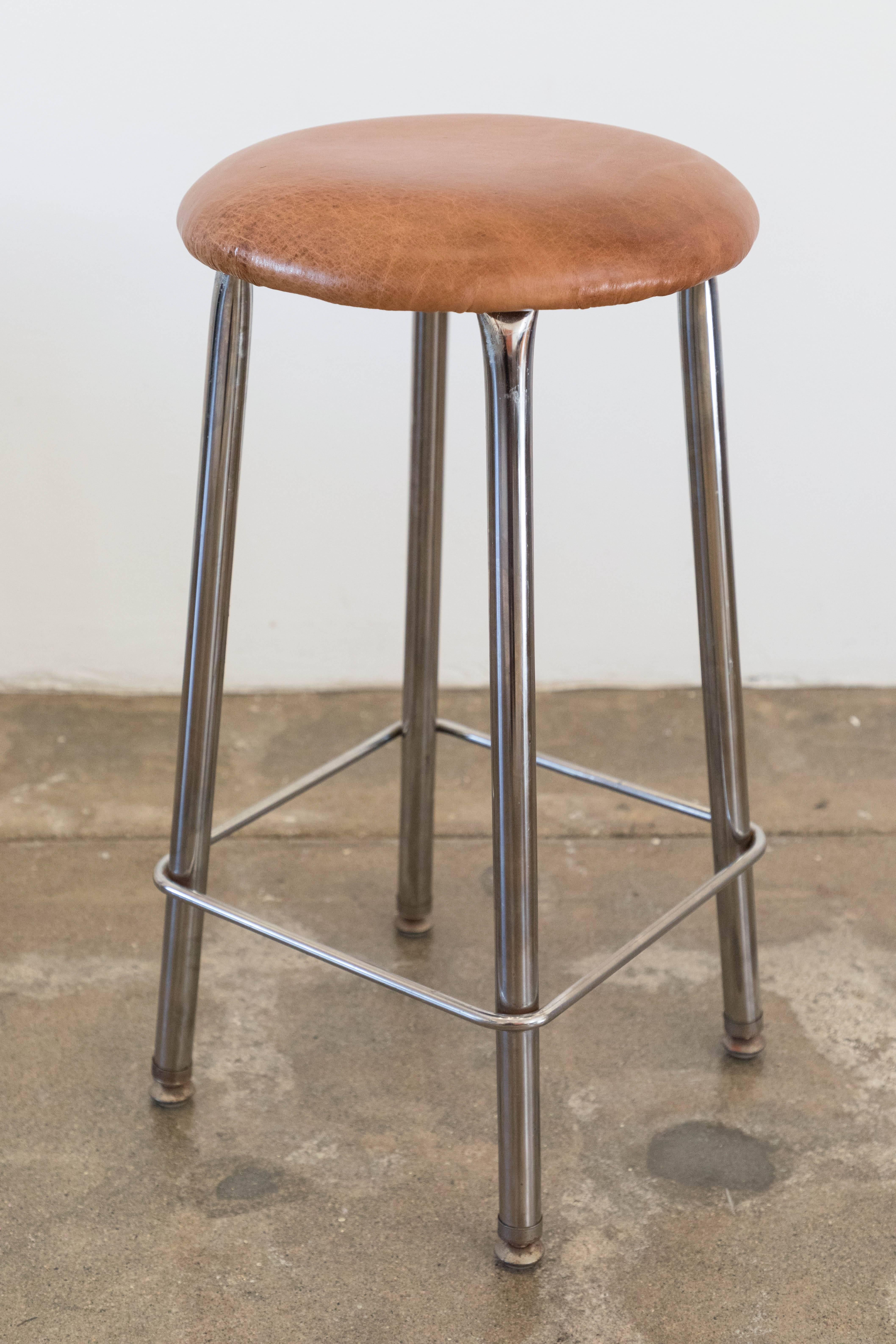 8 stools, 4 in hot pink leather and 4 in light brown leather, with chrome legs. Counter height. new foam and leather.