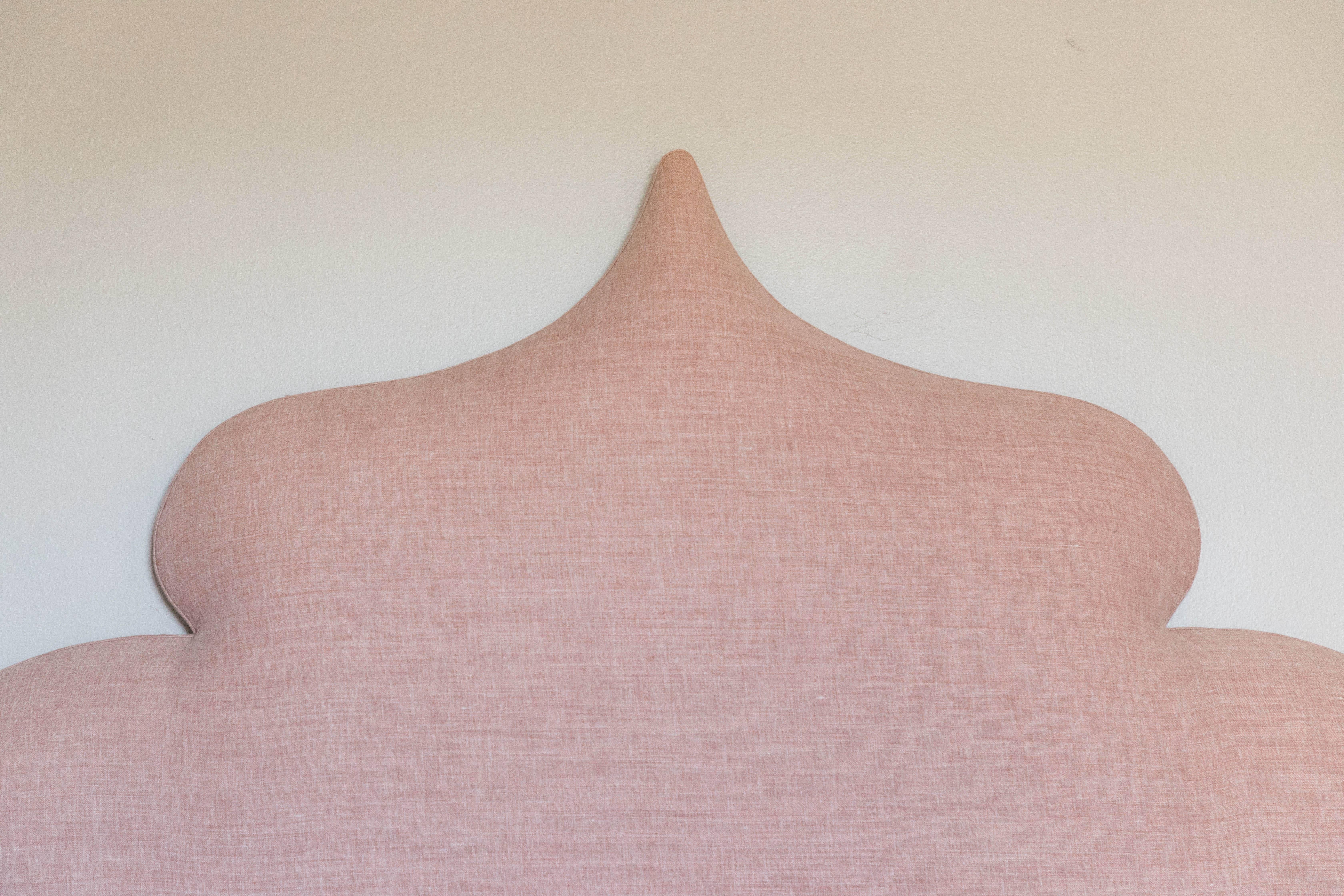 Two Moroccan style vintage headboards covered in blush pink Calvin linen. 