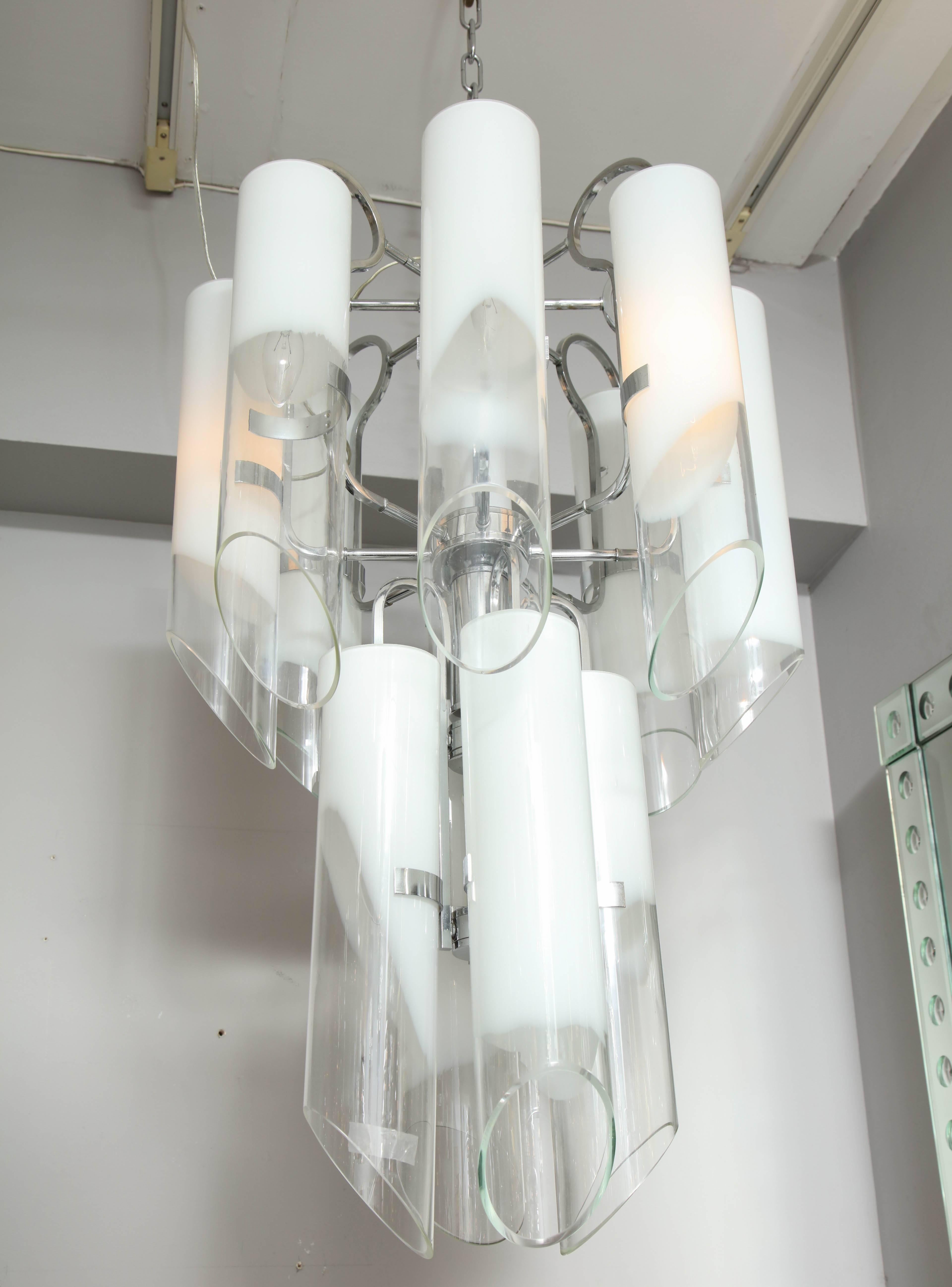 Vintage white Mazzega tubular glass chandelier. There is a light socket inside of each tubular glass to illuminate. Minimum aging shows on the frame.