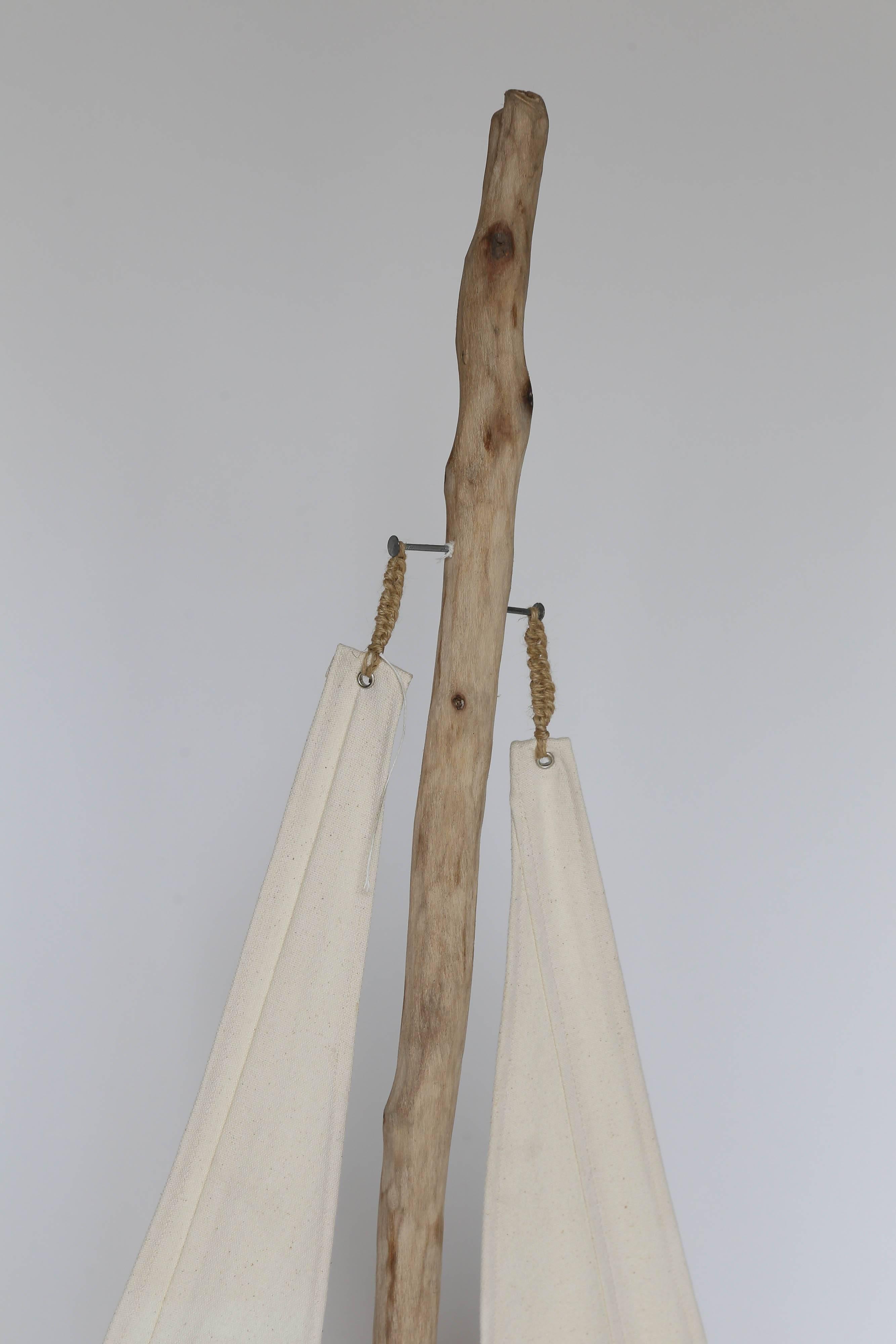 This sailboat is a creation from the Catalan region of Spain. The husband and wife team creates art that brings nature closer to your home in a decorative and functional way. The body of the boat is made from a piece of sea driftwood that was