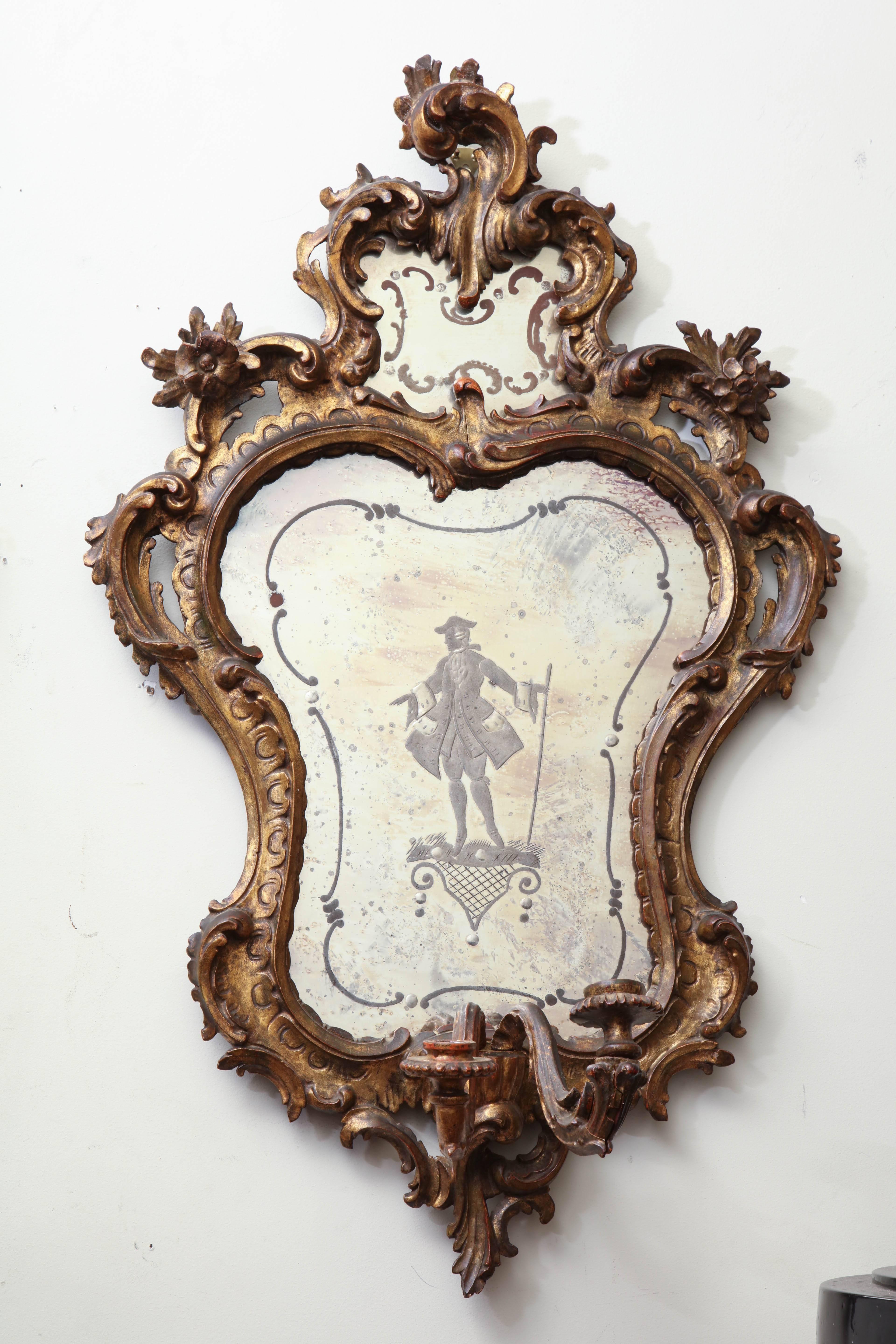 Pair of Italian carved giltwood Rococo two-light wall mirrors with figural etched glass.