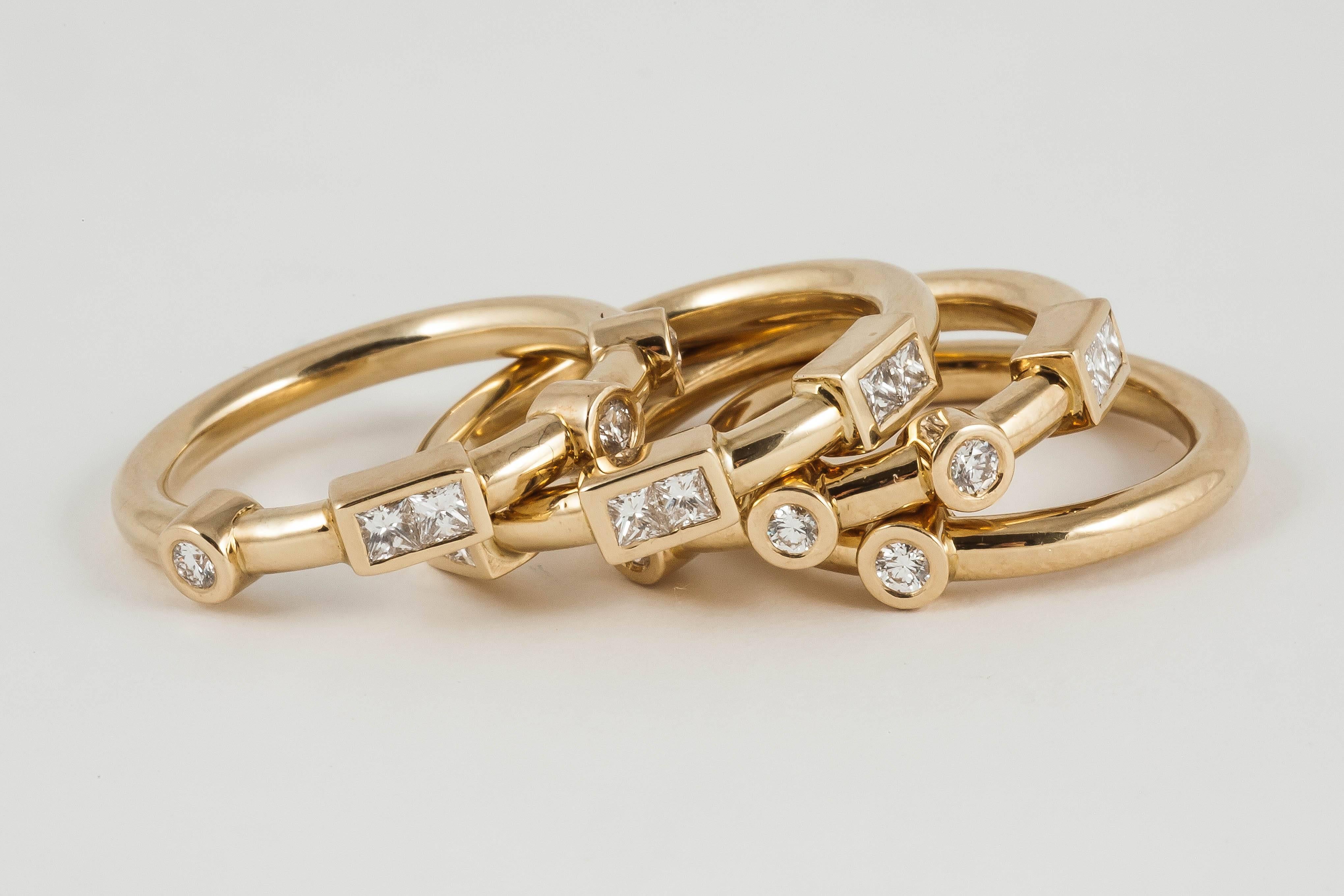 Contemporary 18k Yellow Gold and White Diamond Love Stacking Rings spelling 