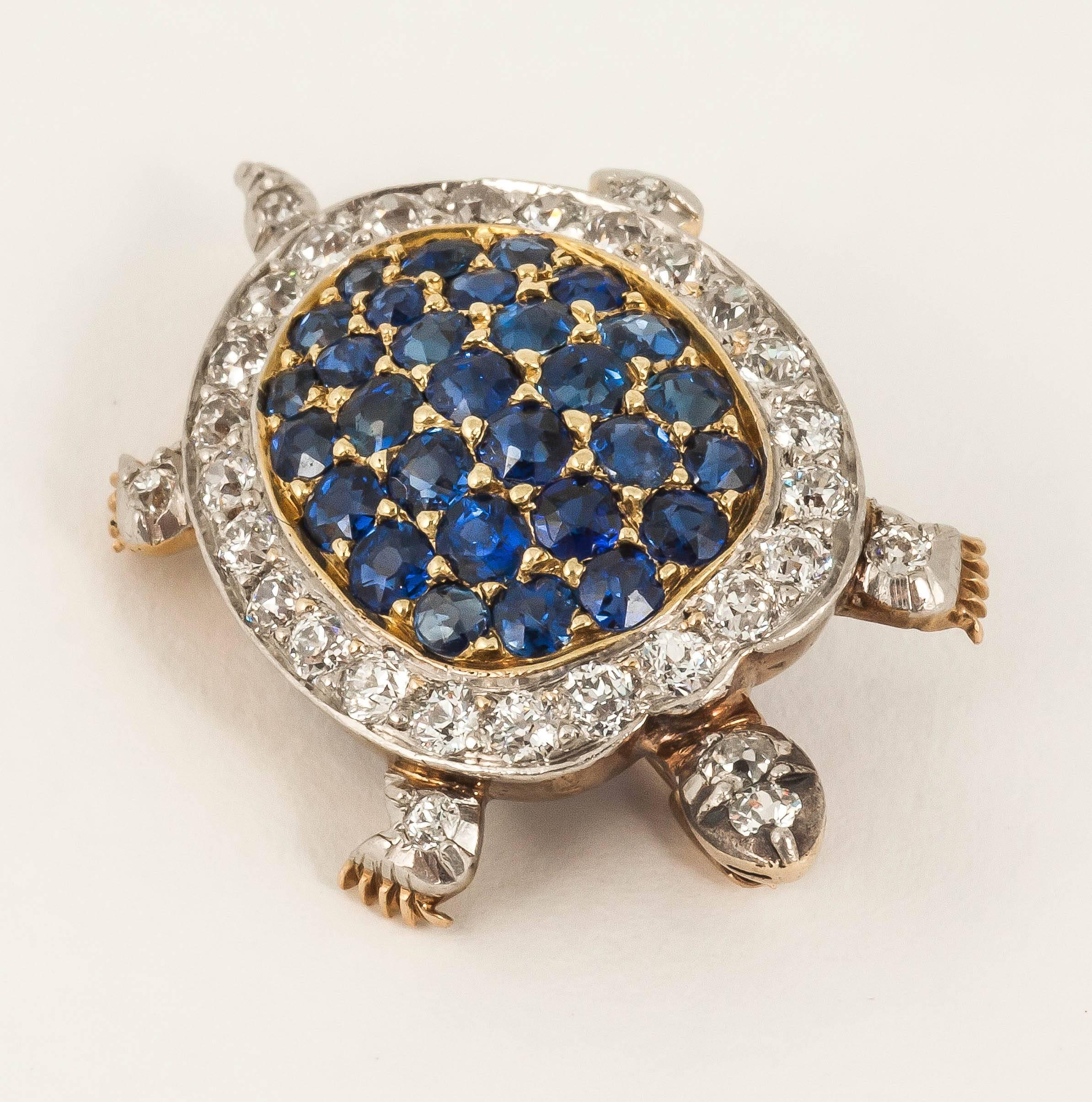 A finely made Platinum and yellow gold mounted, tortoise brooch set with fine coloured ceylon sapphires and old cut diamonds.English c 1900
