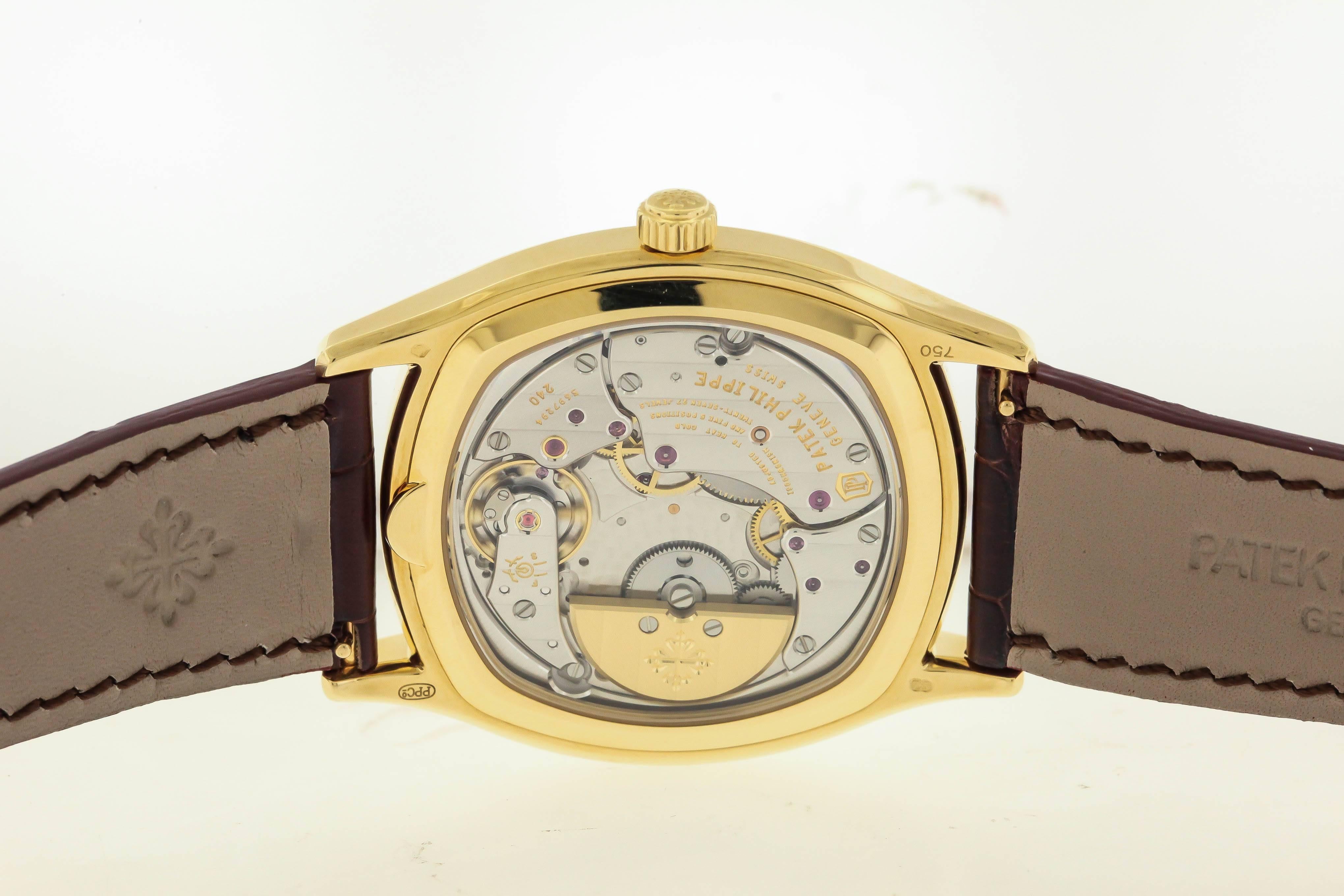 18K yellow gold contemporary Patek Philippe, Ref. 5940J, circa 2013, is a rare cushion-shaped, self-winding, 18K yellow gold wristwatch with perpetual calendar, moon phases, 24-hour indication and an 18K yellow gold Patek Philippe buckle,