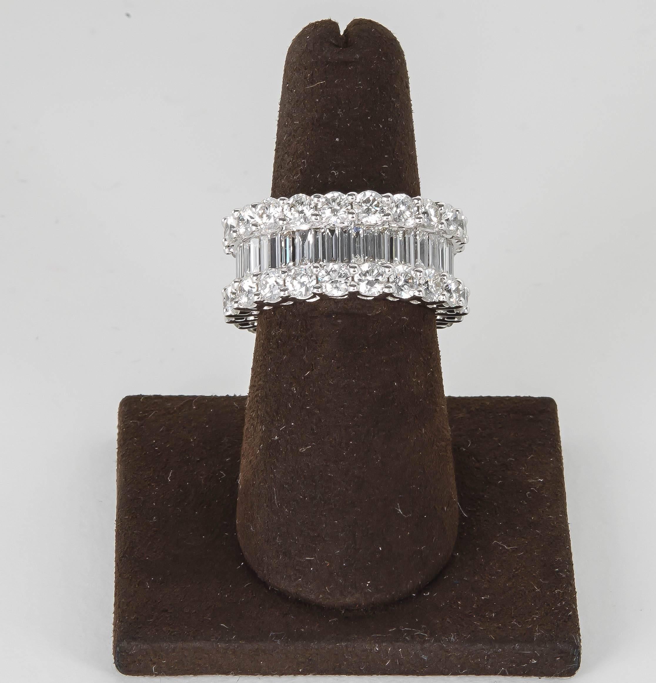 

A FABULOUS ring -- non stop SPARKLE!

8.58 carats of FG color VS clarity baguette and round brilliant cut diamonds set in 18k white gold. 

Approximately 10.4 mm wide

Size 6.5