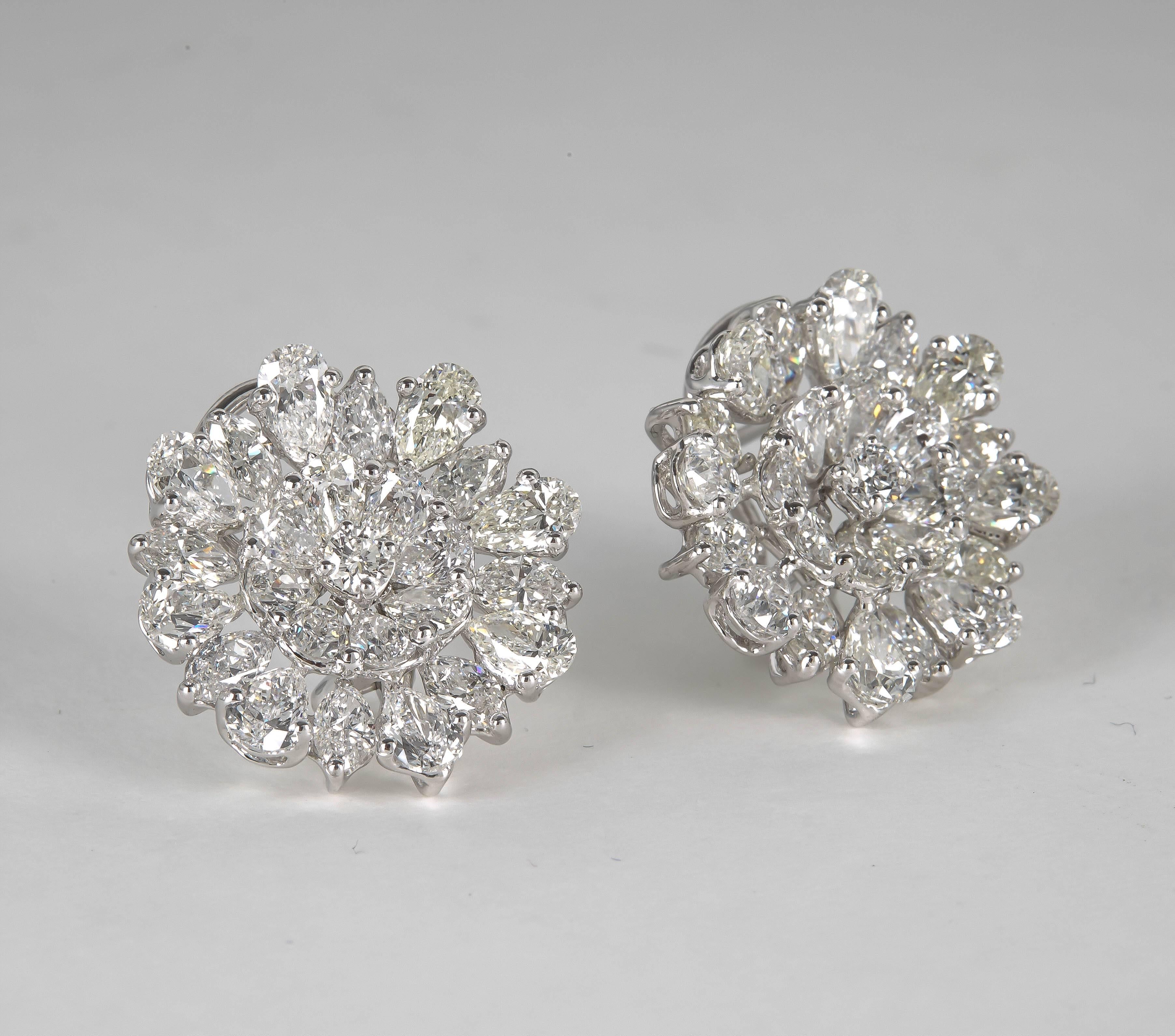 A fabulous earring and a rare find!

14.30 carats of round brilliant, pear and marquise cut diamonds set in platinum. 

A magnificent design -- F/G VS diamonds.

Approximately 3/4 inch in height and width.

Please contact us for more