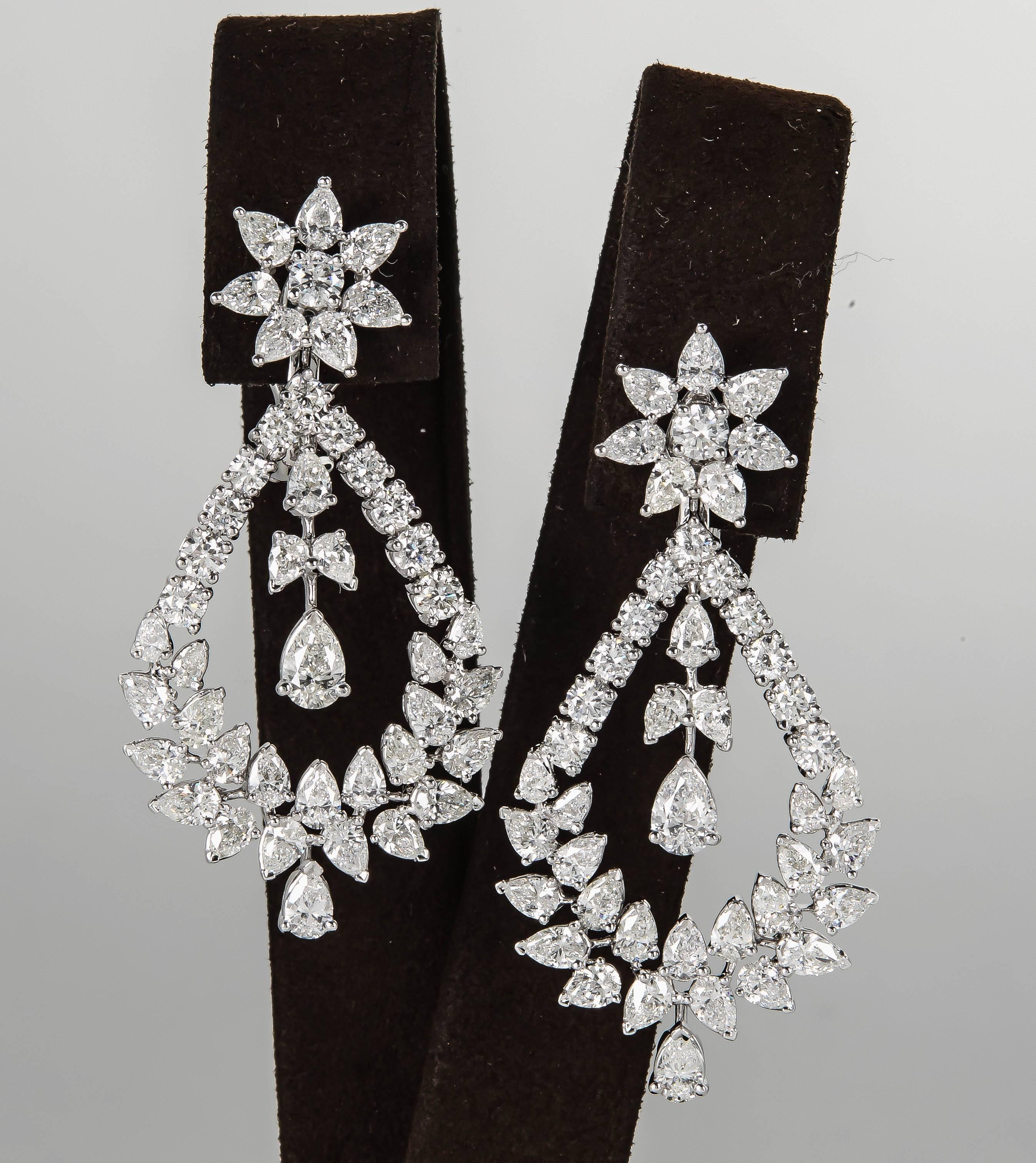 

A unique pair of diamond drop earrings in a timeless design.

11.95 carats of fine round brilliant and pear cut diamonds set in 18k white gold.

This earring measures approximately 2 inches from top to bottom.