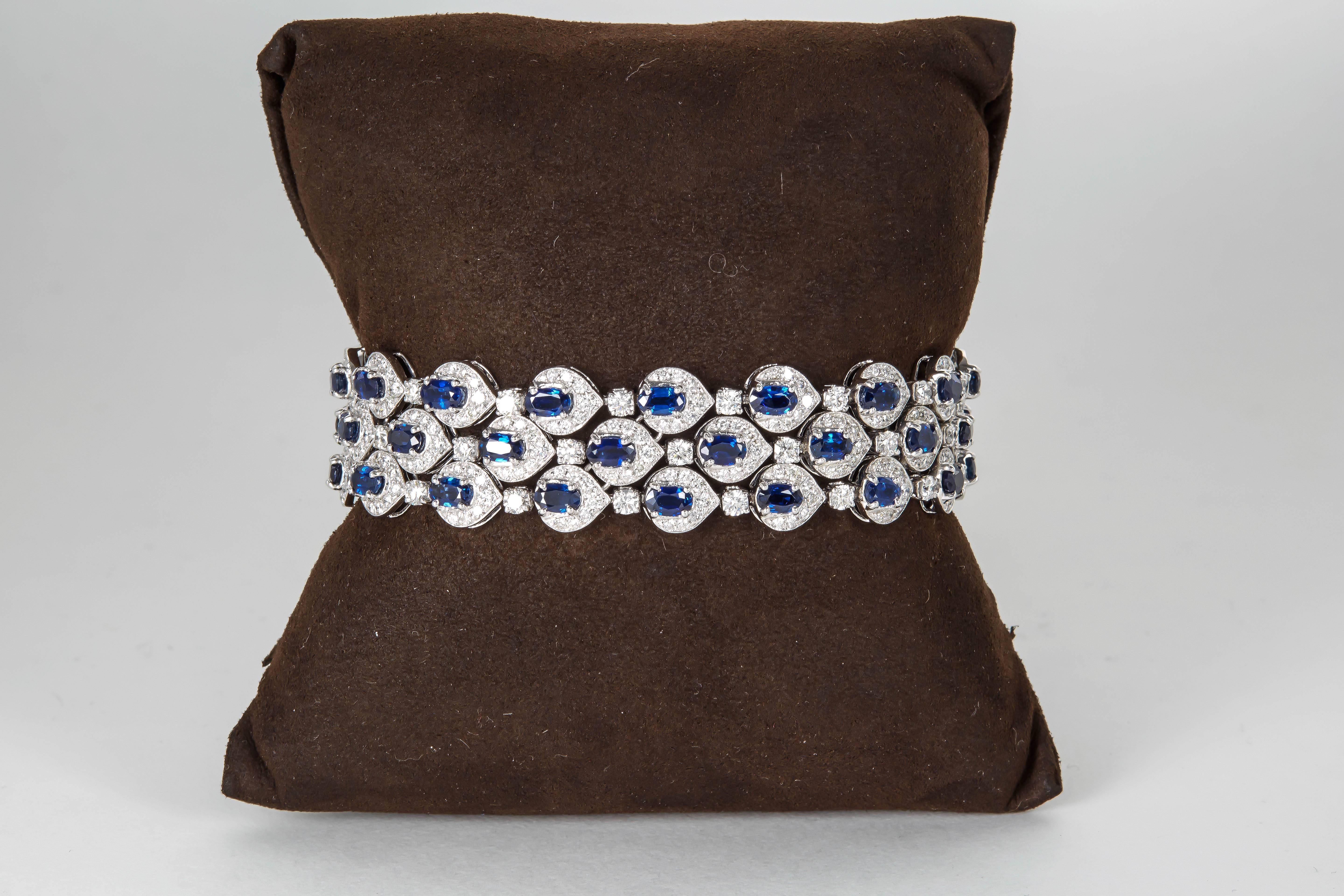 
An elegant sapphire and diamond bracelet in a timeless design.

15.56 carats of fine oval blue sapphires.

9.13 carats of white round brilliant cut diamonds.

18k white gold

Approximately 3/4 of an inch wide.