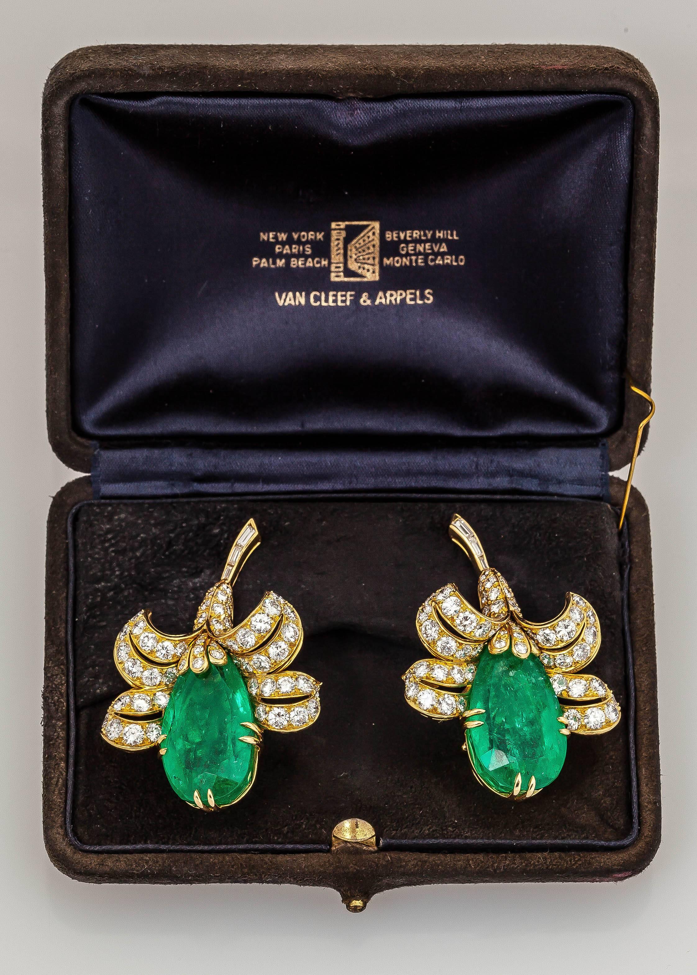 Gorgeous earrings by Van Cleef & Arpels finely crafted  in 18k yellow gold with two pear shaped emeralds weighing a total of approximately 60.00 carats and high quality round brilliant cut diamonds weighing approximately 16.00 carats.