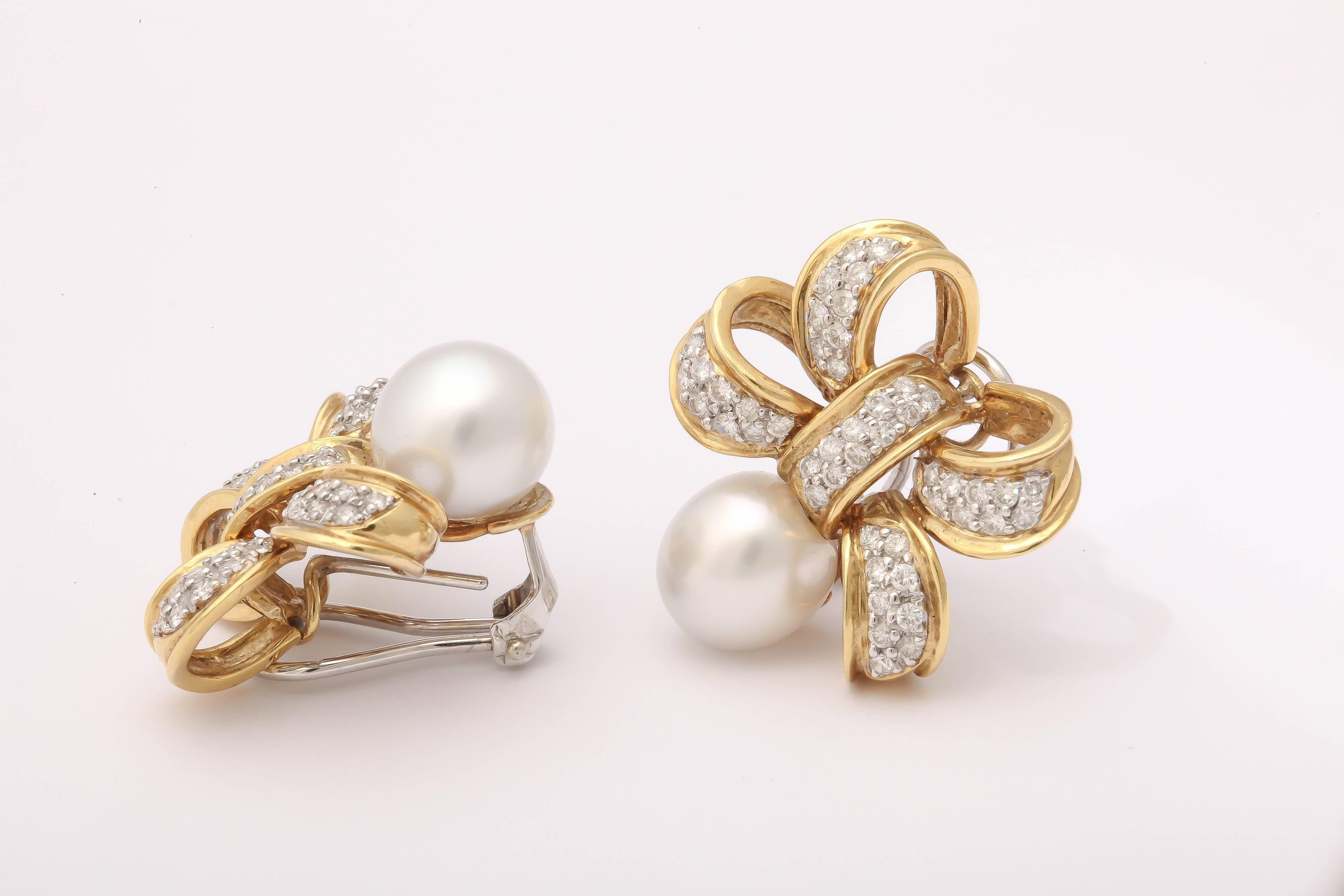 Contemporary Classic and understated pearl Diamond gold Bow Earrings For Sale