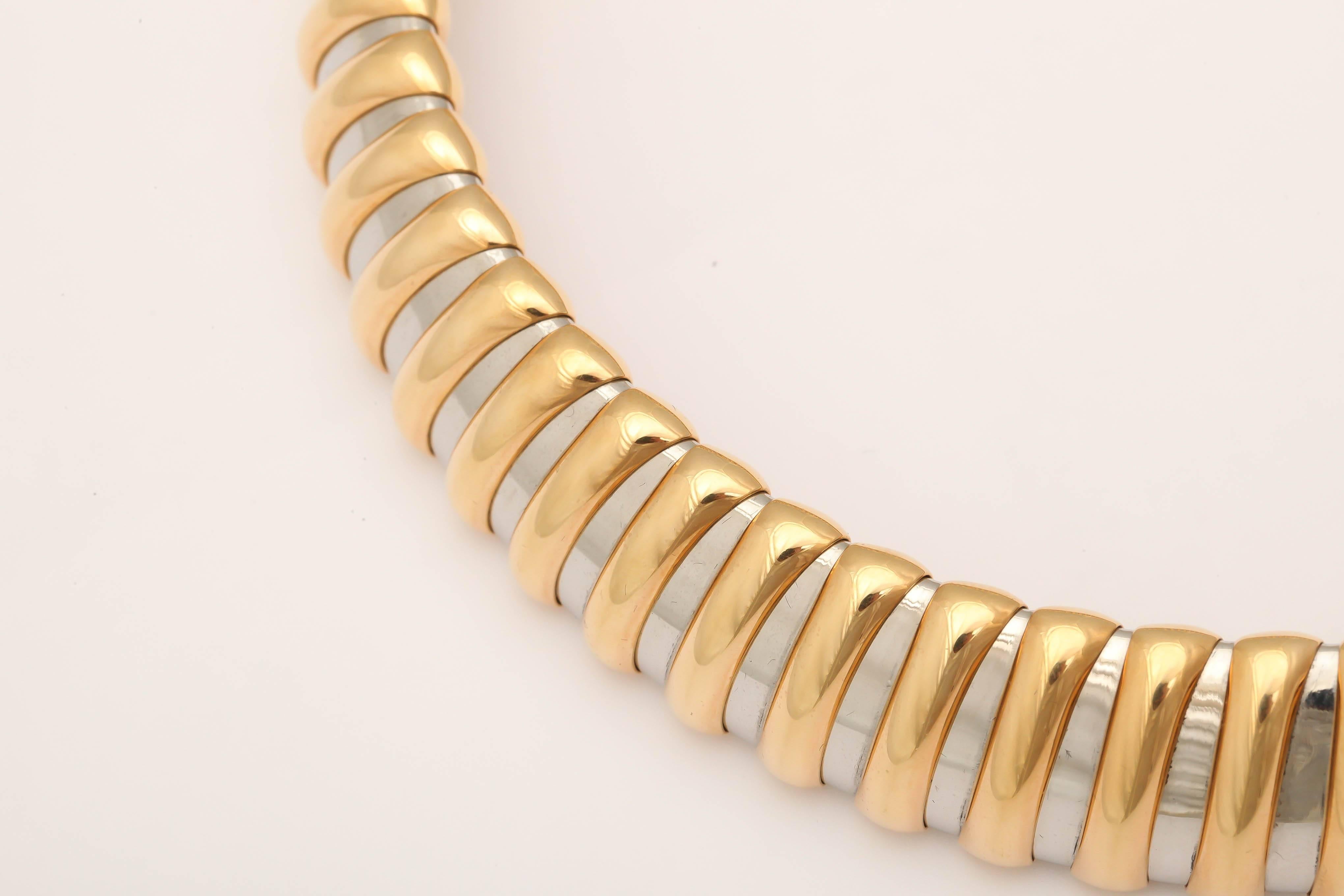 Signed Bulgari Roma 18kt Yellow Gold & Steel turbo Collar.  Beautifully made & fully signed.  When Holly Golightly wasn't wearing her Tiara - one could see her wearing this in her skinny black Dress.  Just over the top.
