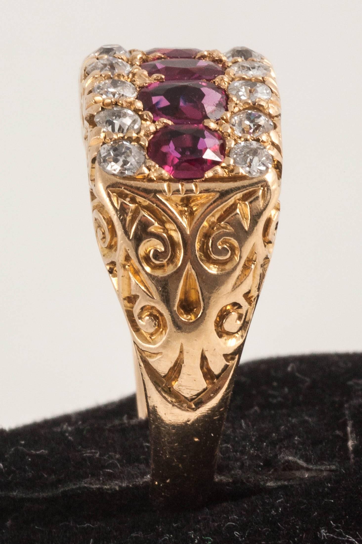 These natural Rubies are flanked by 2 rows of old cut Diamonds set in1`8ct  Gold

Finger size M