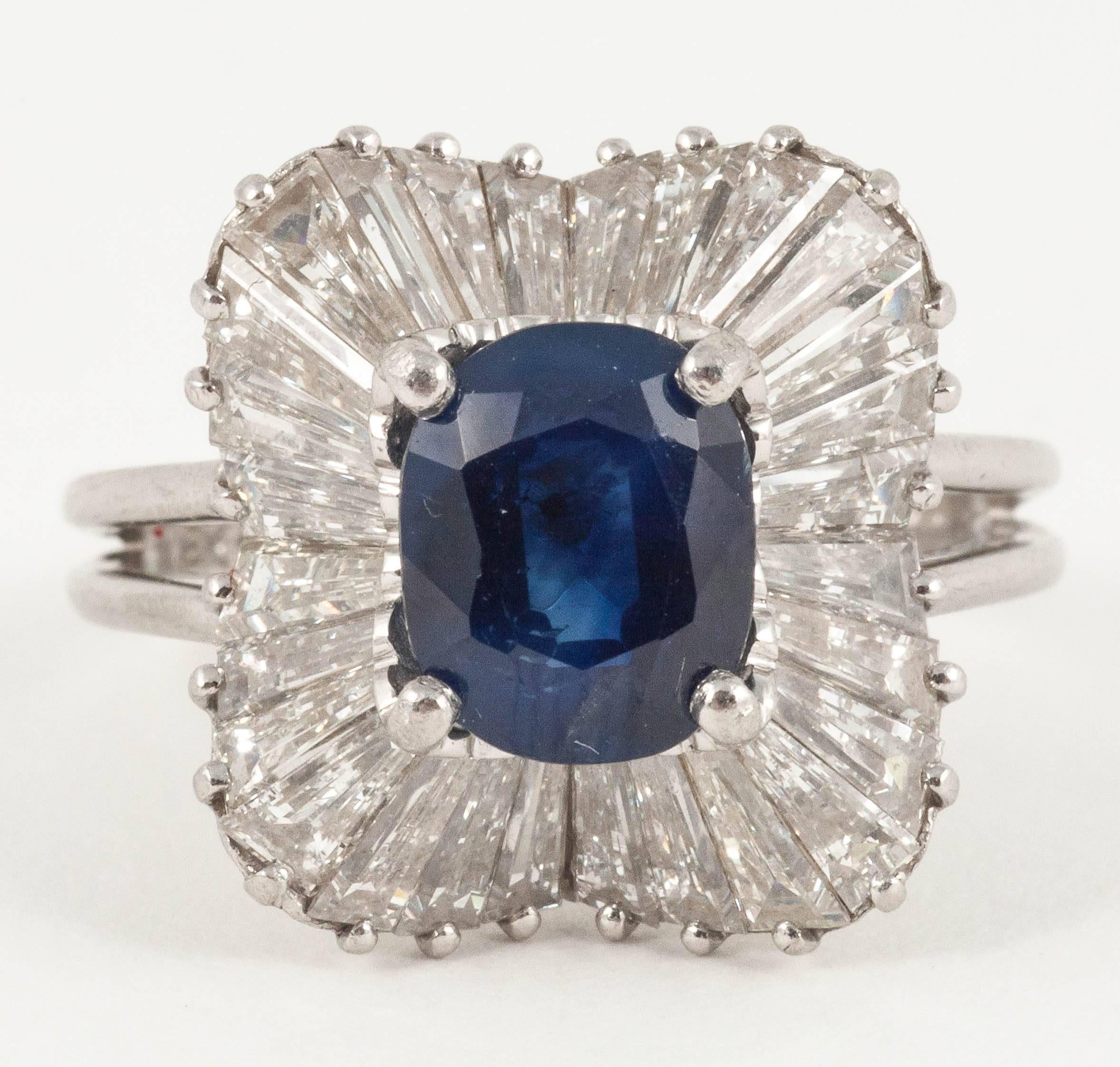 This 1960's Ballerina ring is set with natural Ceylon Sapphire surrounded with baguette Diamonds

Finger size M
