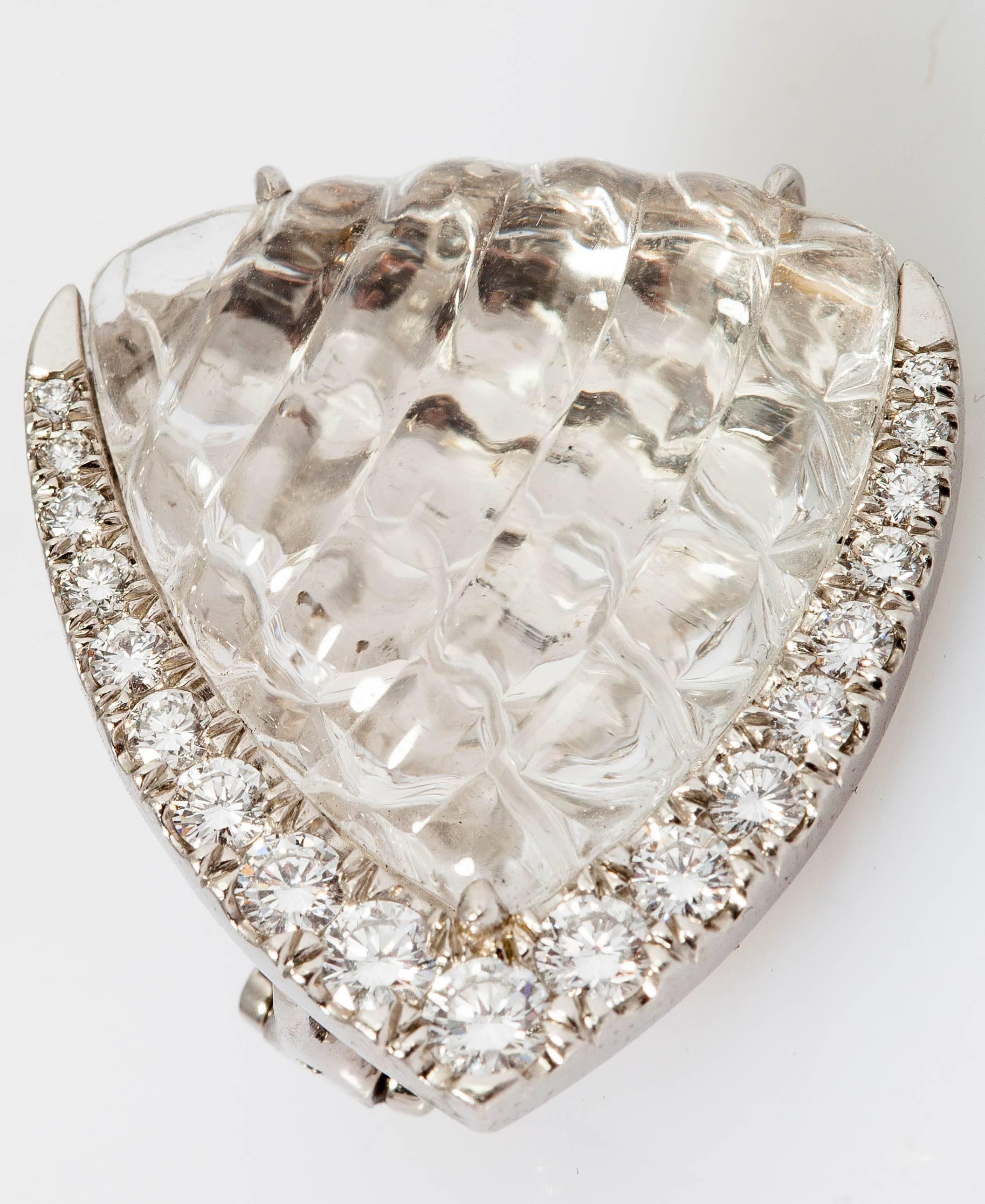 This beautiful necklace and earrings display carved rock crystals with brilliant cut diamonds weighing approx. 15 carats, mounted in platinum. 