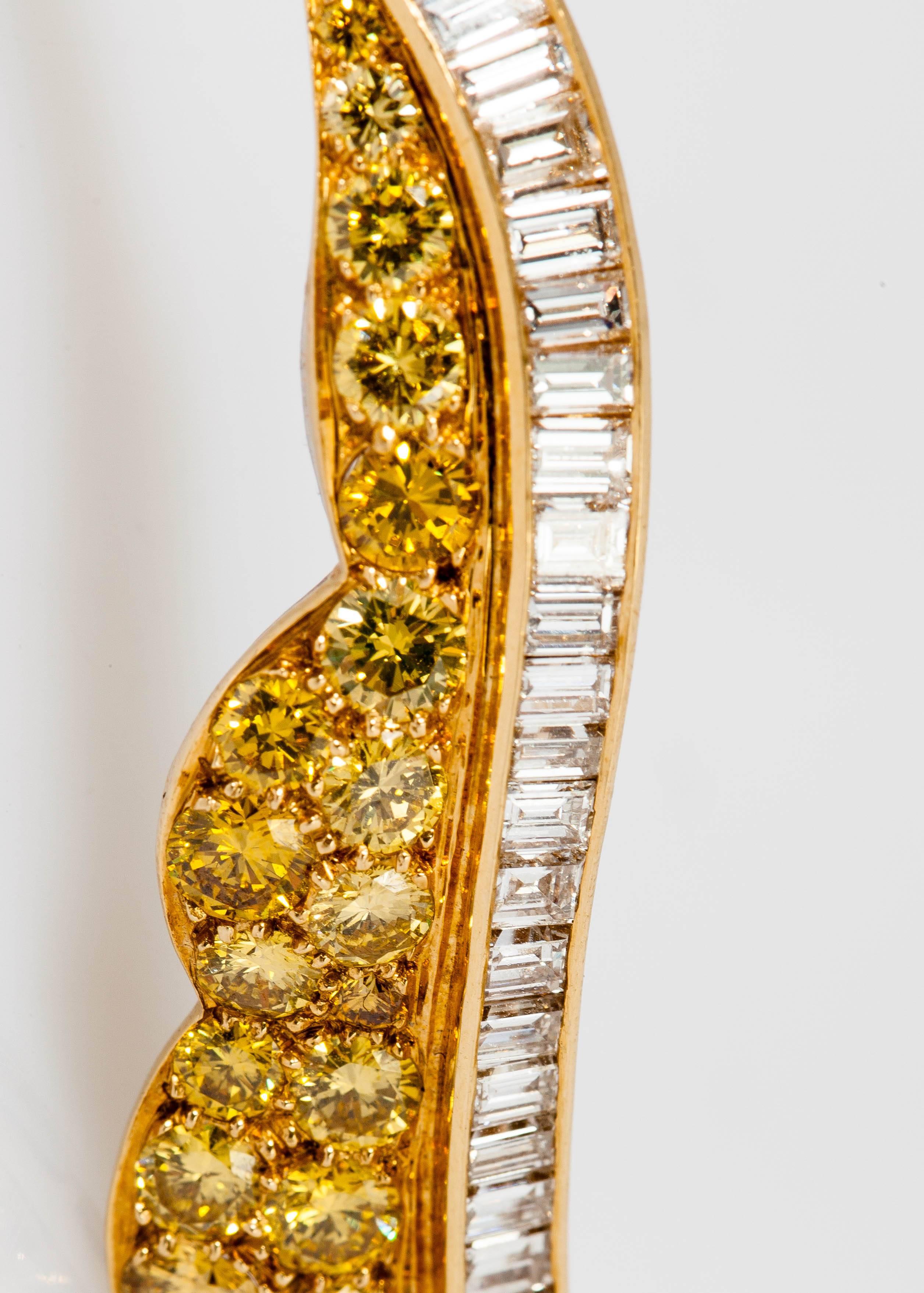 Designed as a stunning leaf of fancy-yellow diamond weighing approx.5.00 carats and baguette diamonds weighing approx. 3.50 carats, mounted in 18k yellow gold and platinum.