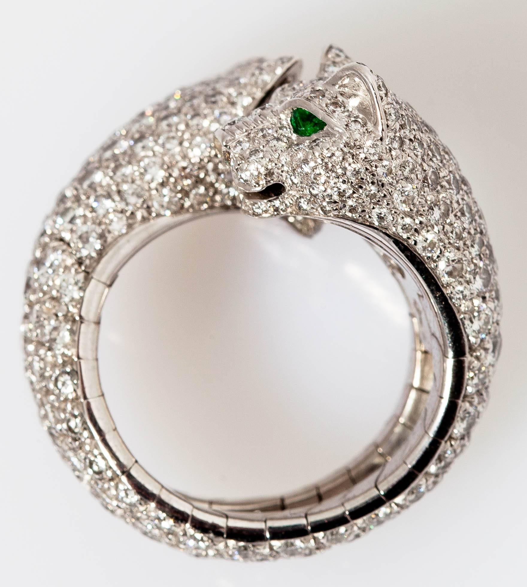 Beautiful ring designed as a 18k white gold, accented by 4 emerald eyes and pave brilliant diamonds. Rare piece, part of Cartier's 