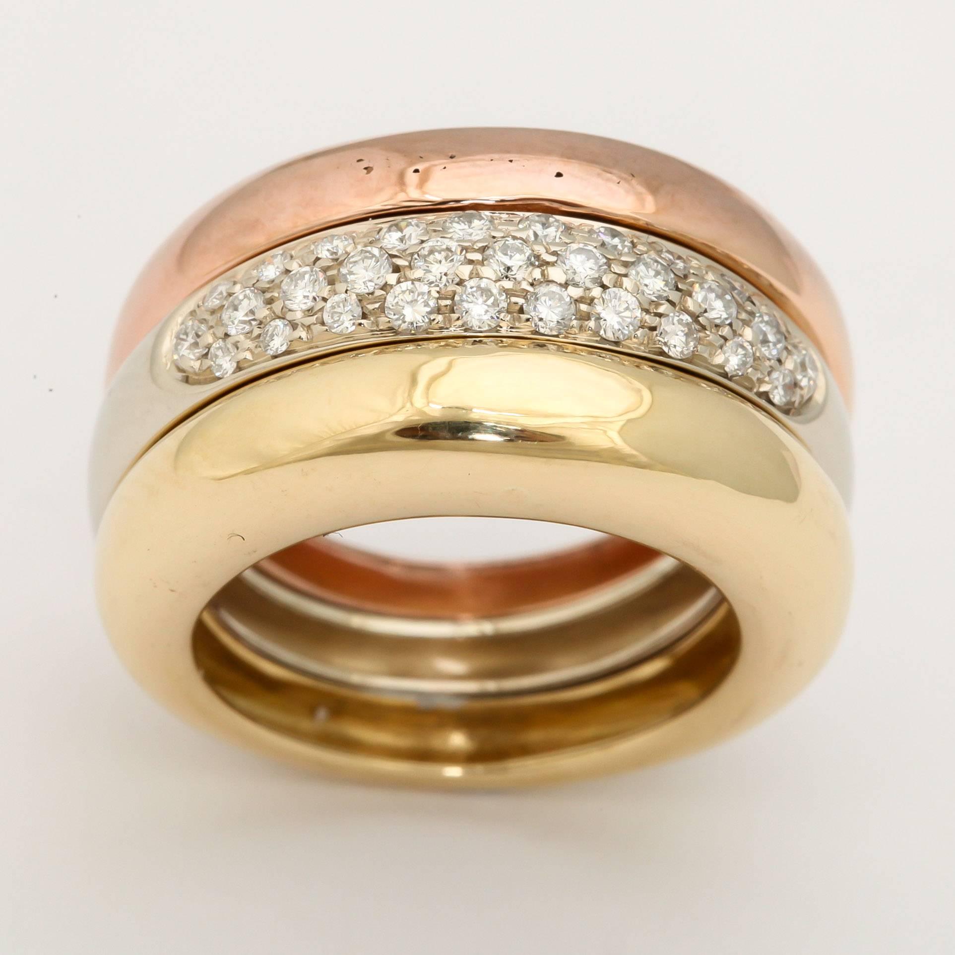 18kt yellow,pink& white gold Classic triple moveable bands ring embellished with 1 carat of very high quality full cut diamonds circa 1990's designed by Cartier Made in France.Ring is currently a size 5.5 and may be easily Resized to any size you