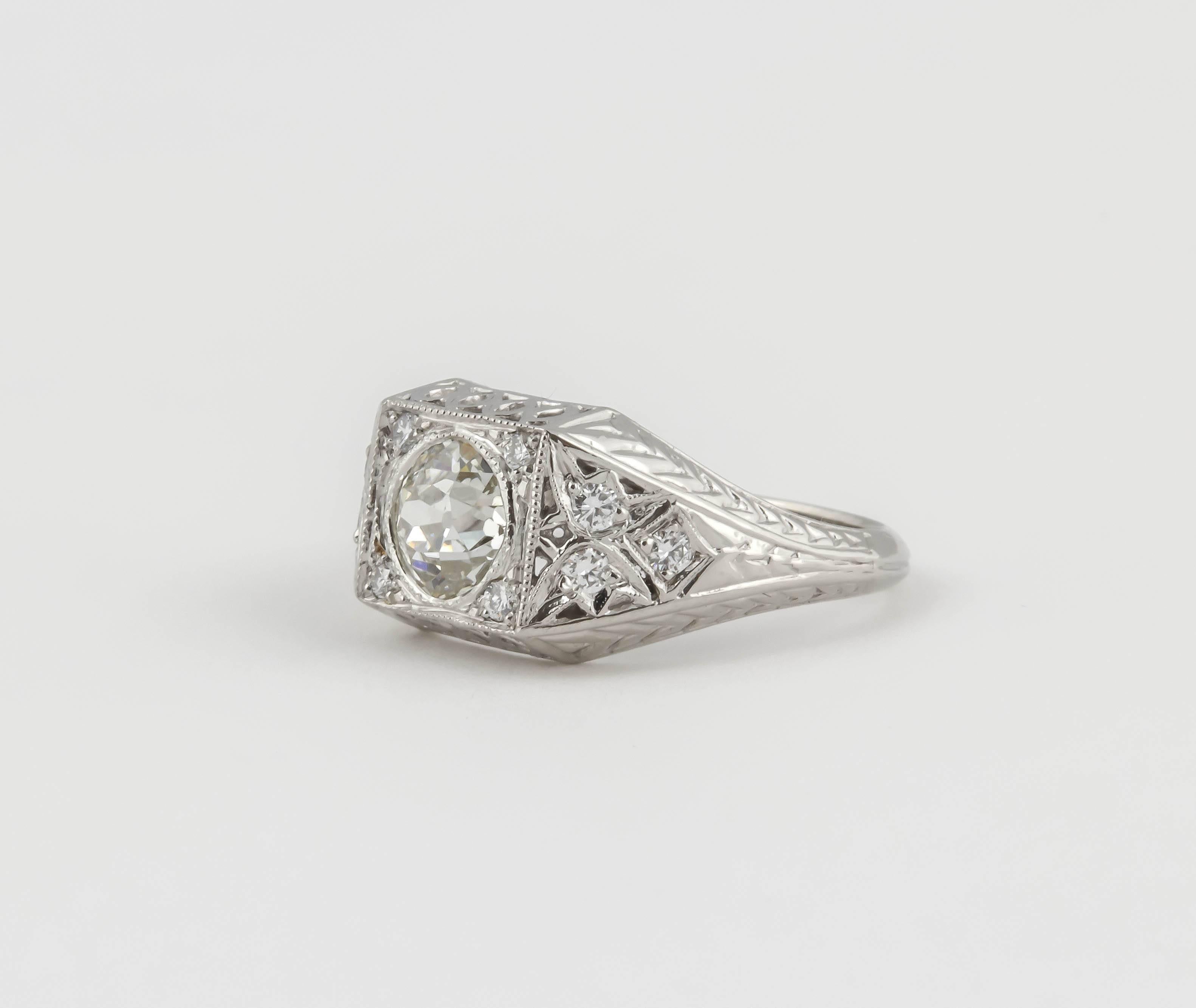 This beautiful ring sports an .89 ct old mine diamond. There is no cert but the diamond is white, no tinge of yellow. It is set in an antique style platinum ring with a diamond pave set on each corner of the top and 3 on each side of the ring.
The