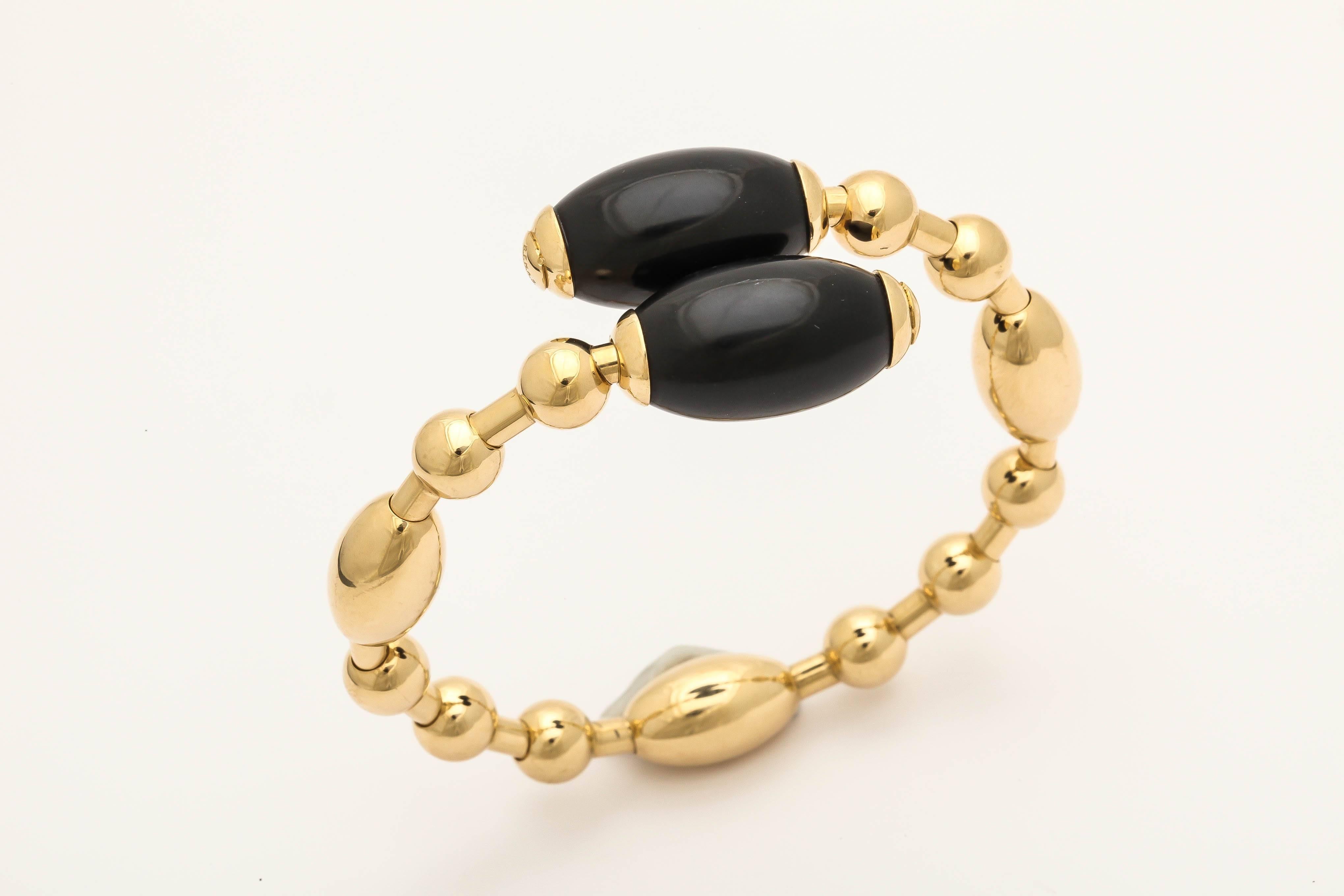 18k yellow gold and onyx bracelet.