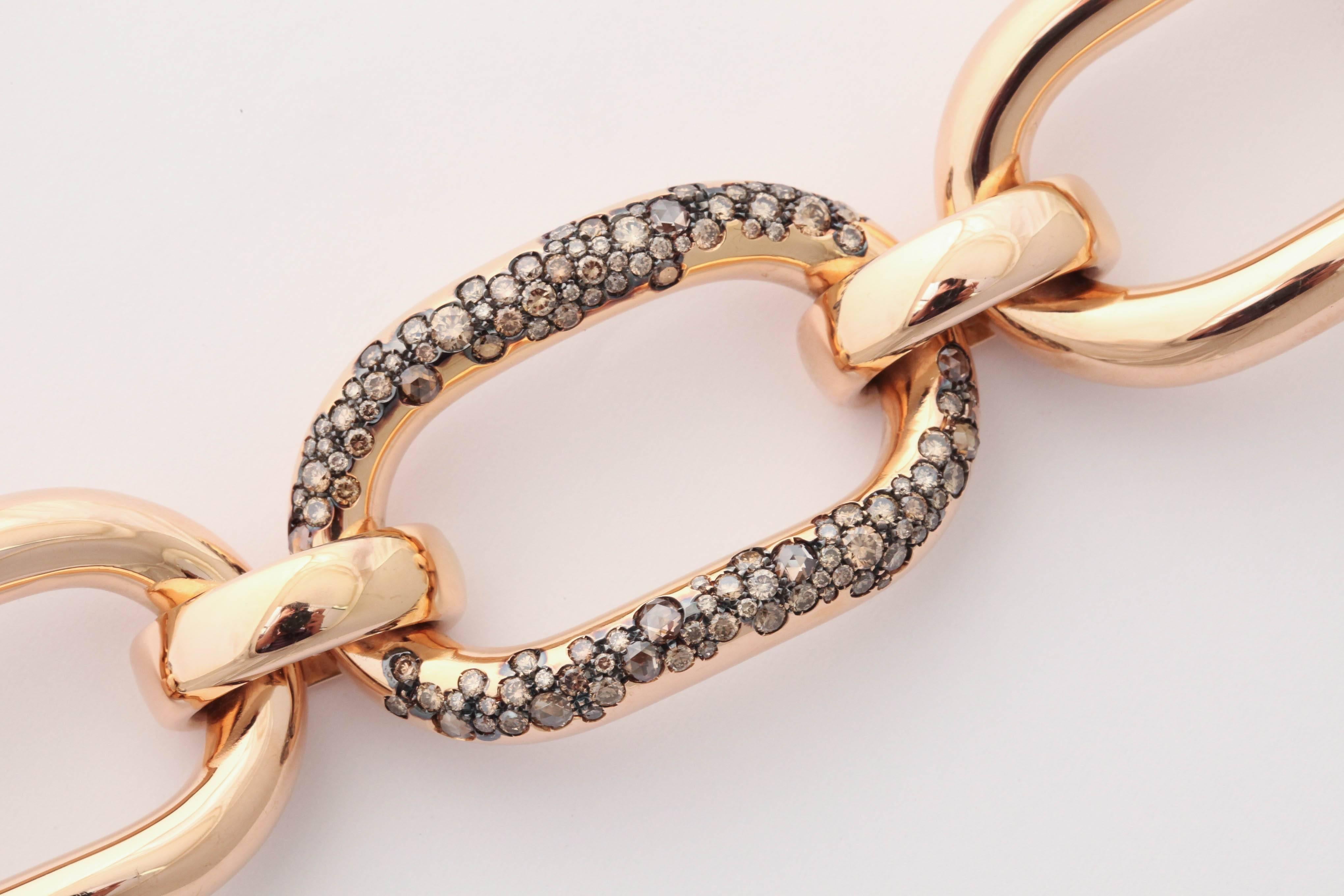 18k rose gold flexible bracelet, 
200 round brilliant cut cognac diamonds and 19 20th century cut cognac diamonds total weight 6.21  93.5 grams