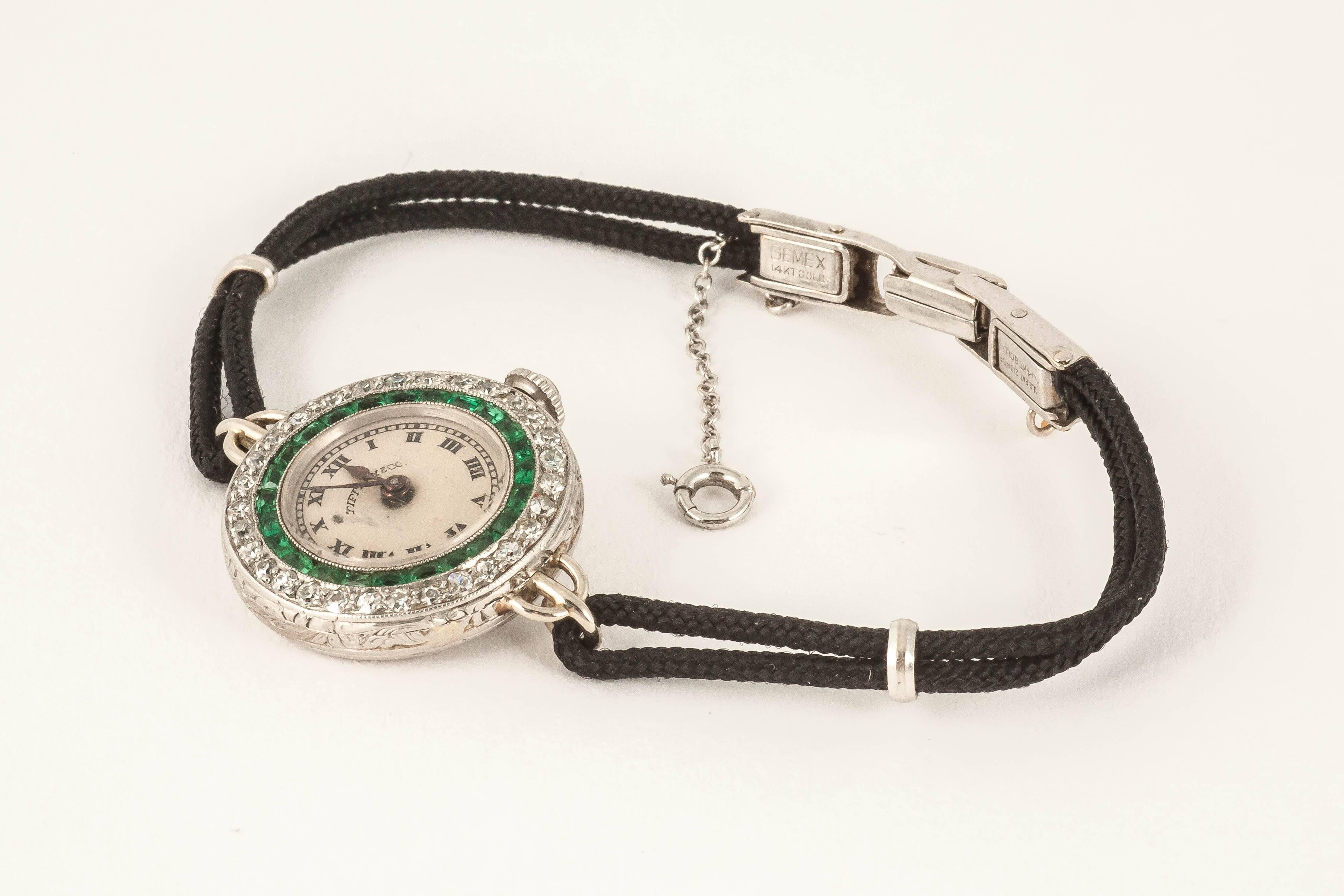 Tiffany & Co. lady's platinum diamond emerald evening dress Wristwatch In Excellent Condition In London, GB