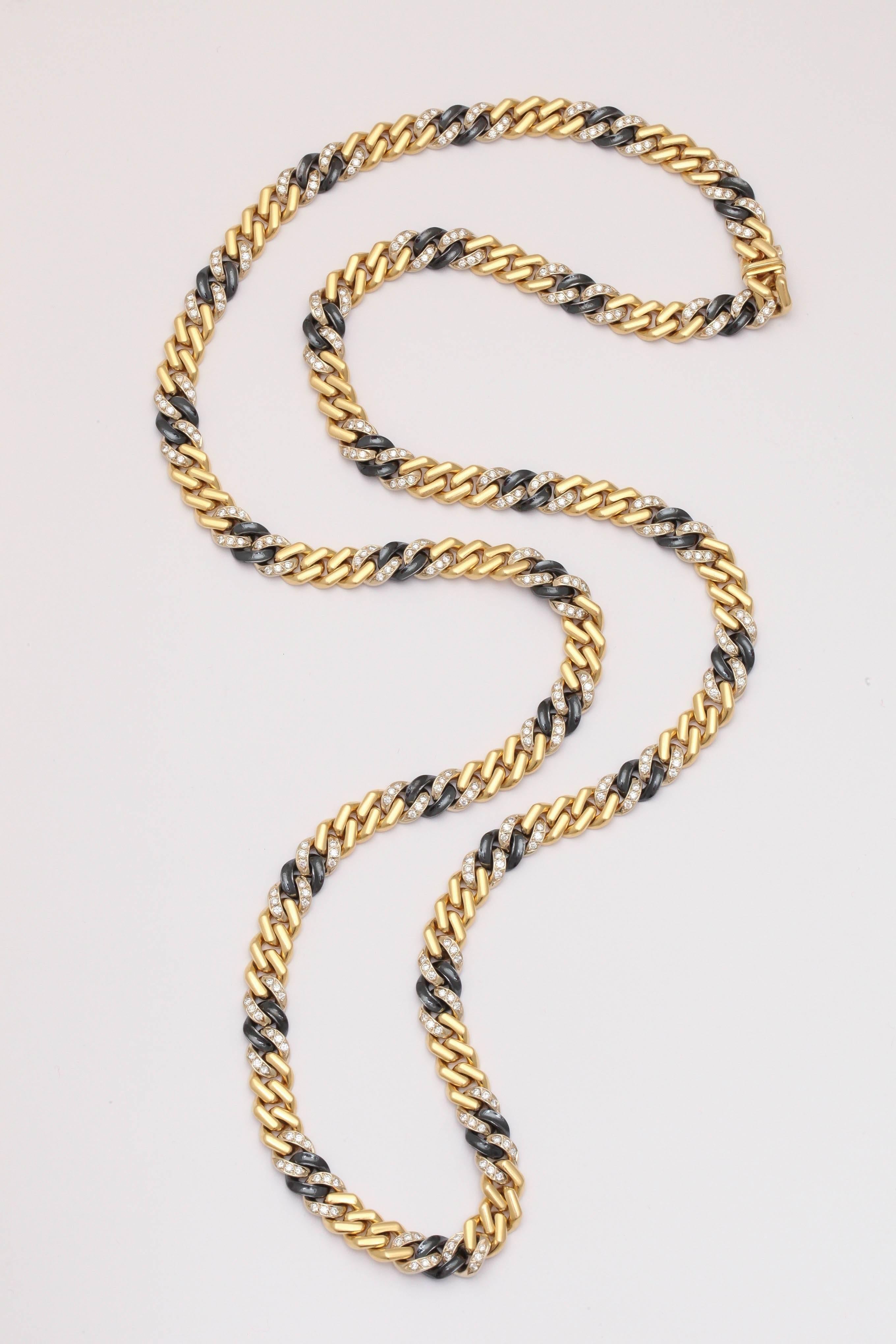 Chic, Chic, & even more Chic.  Bulgari 1960's 18kt chain with alternating Gold & Diamond links connected by a single gun metal link.  Total of 324 full cut - clean white Diamonds.  Approximately  9cts Total and a total of 32