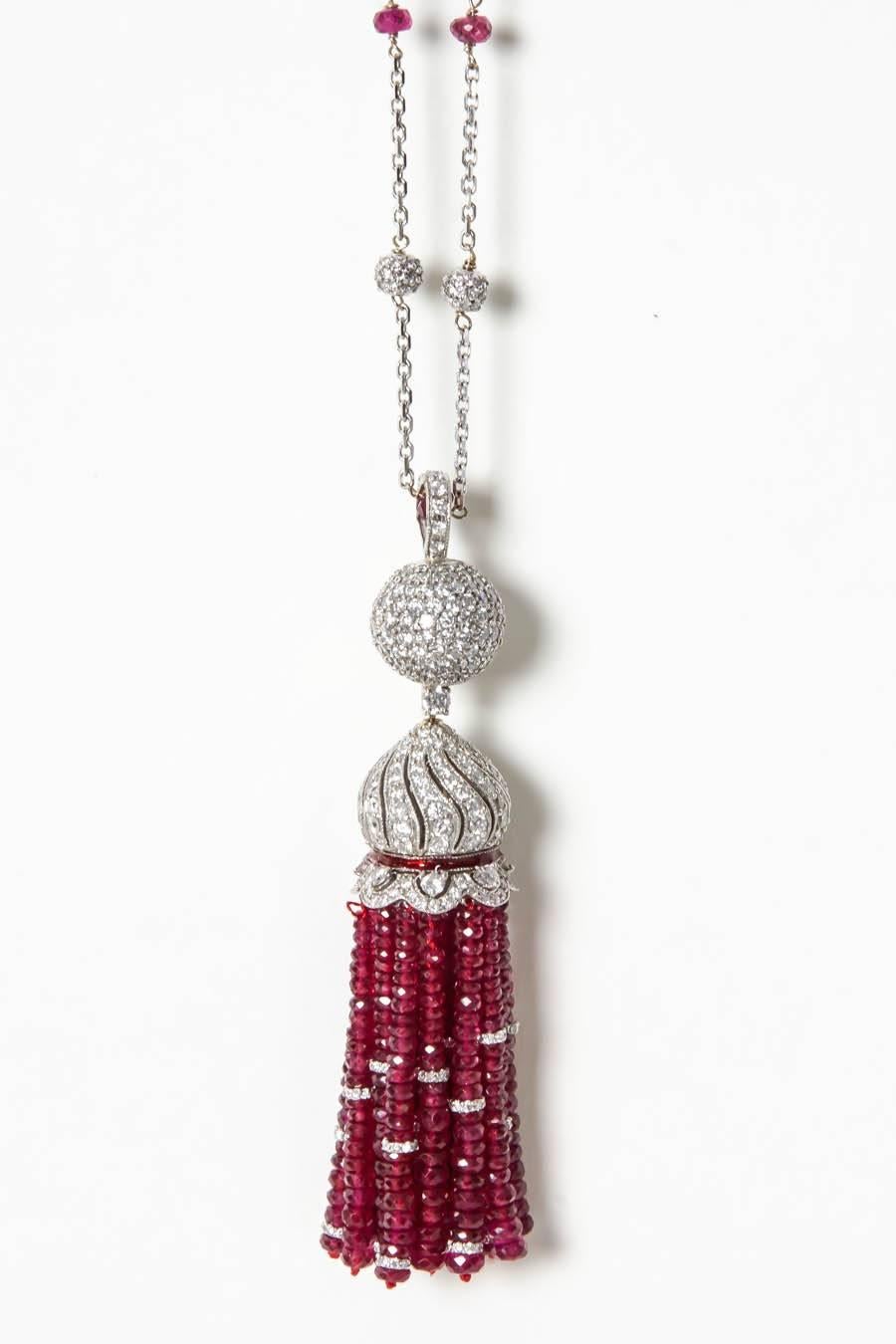 High quality tassel necklace made in New York.

We use the finest Burma Ruby beads -- 70 carats in this tassel!

9.37 carats of round brilliant cut diamonds all set in 18k white gold. 

A fun and fabulous piece!