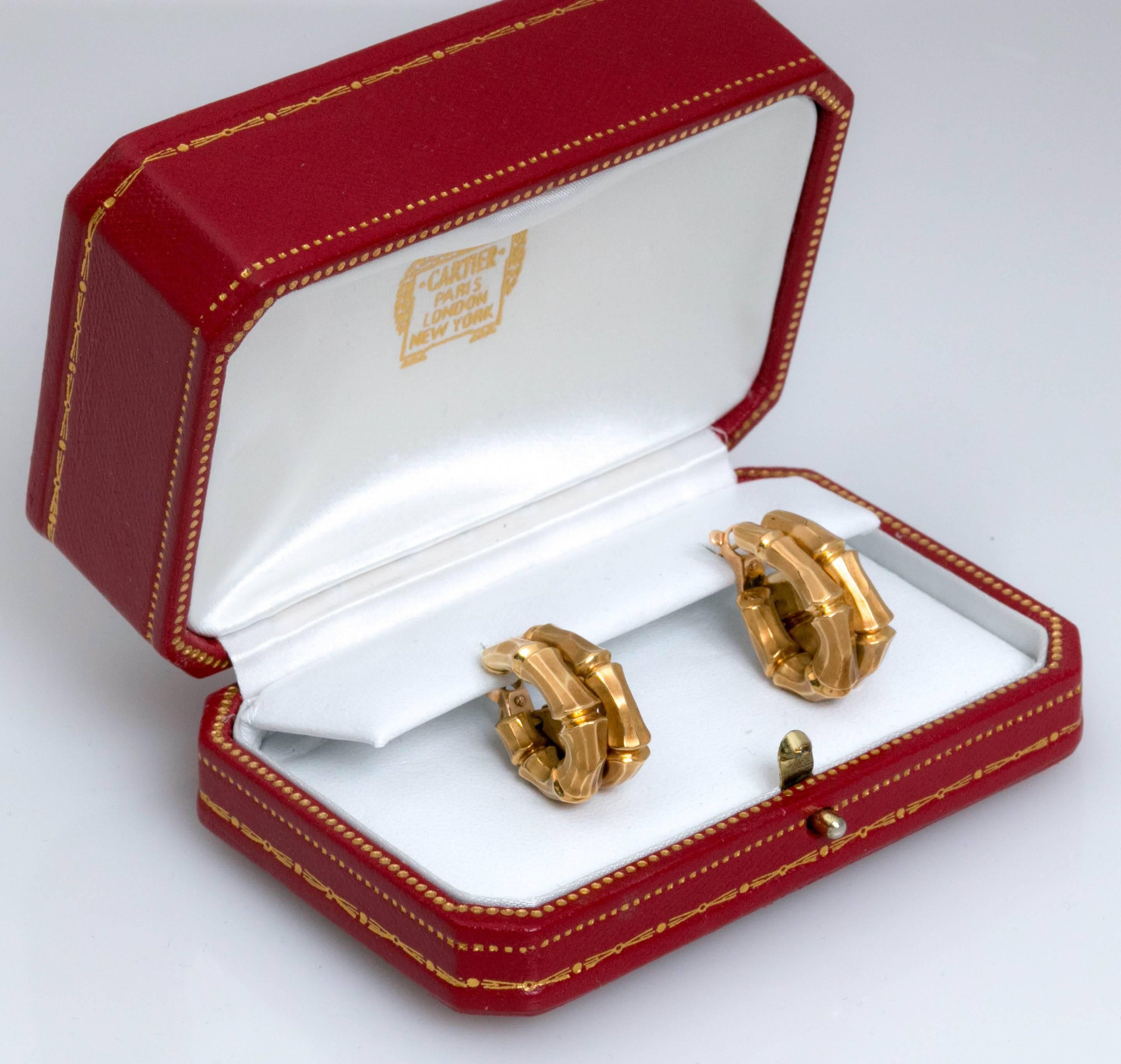 Signed Cartier Double hoop Bamboo earrings. 18K Gold with original booth.