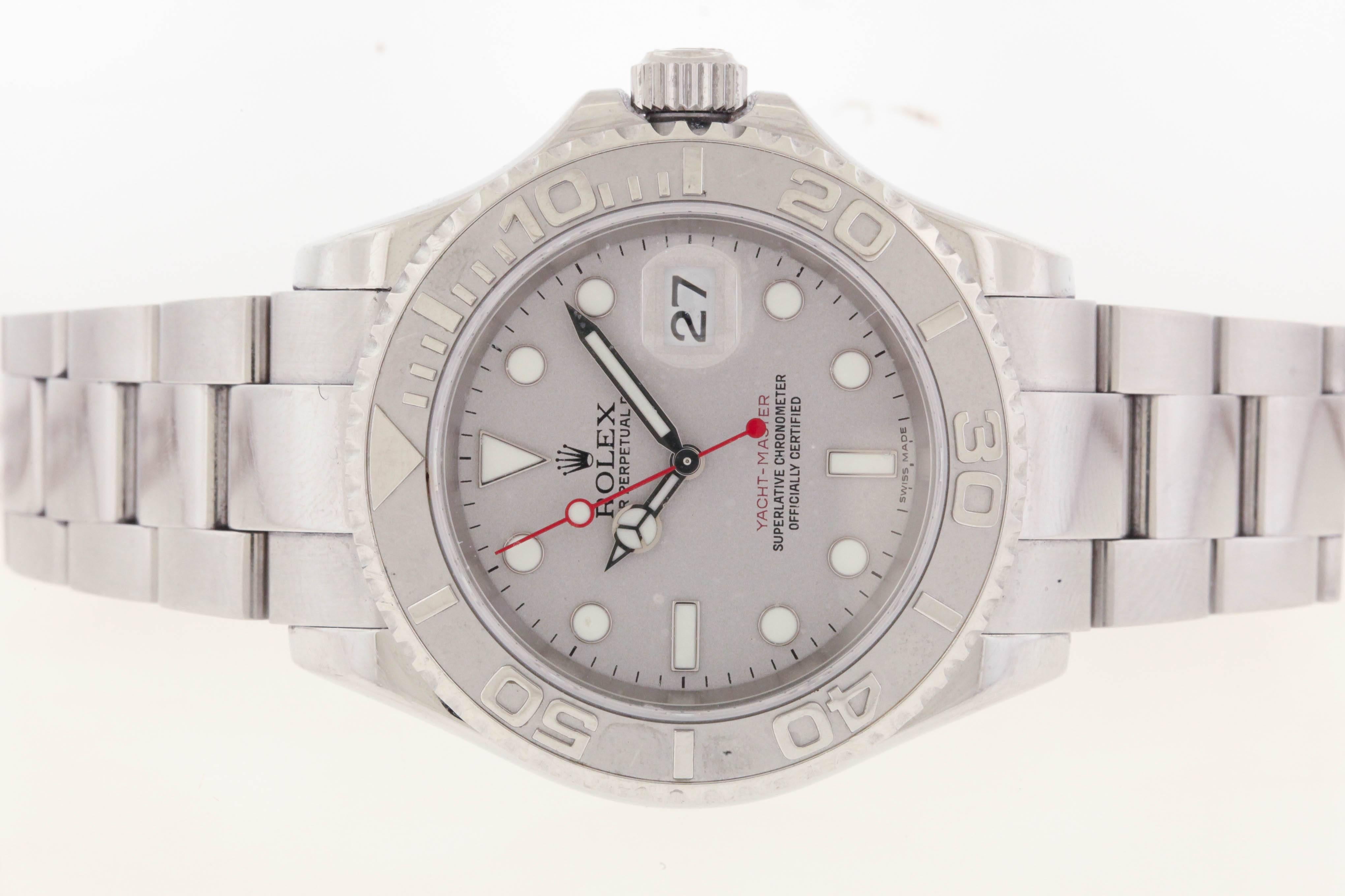 Stainless steel Rolex Yacht-Master Oyster Perpetual, circa 2006, Ref. 16622, is a 40mm self-winding water-resistant wristwatch with red center second sweep hand and date at 3 o'clock. The case has a screwed-down back, Rolex Oyster bracelet with