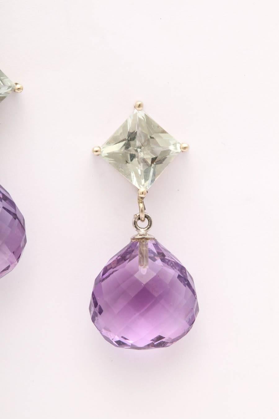 Set in 14 kt white gold to show the true soft colors of both types of amethyst. These earrings sit and swing beautifully on the ear. Great for upcoming spring fashions. The green amethyst is 8 mm square French cut, the green color doesn't show up in