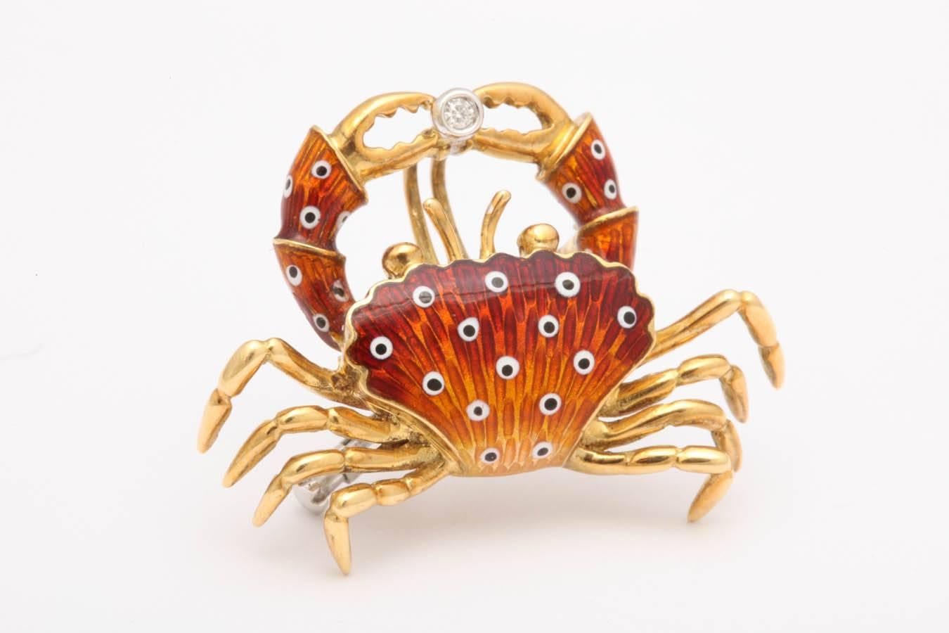 This lovely crab is 18 kt gold and made in Italy. It can be worn as a pin or on a cord, chain, or Omega necklace. The Italians are the best enamelers and have be making enamel jewelry for centuries. The enamel graduates from yellow on the bottom
