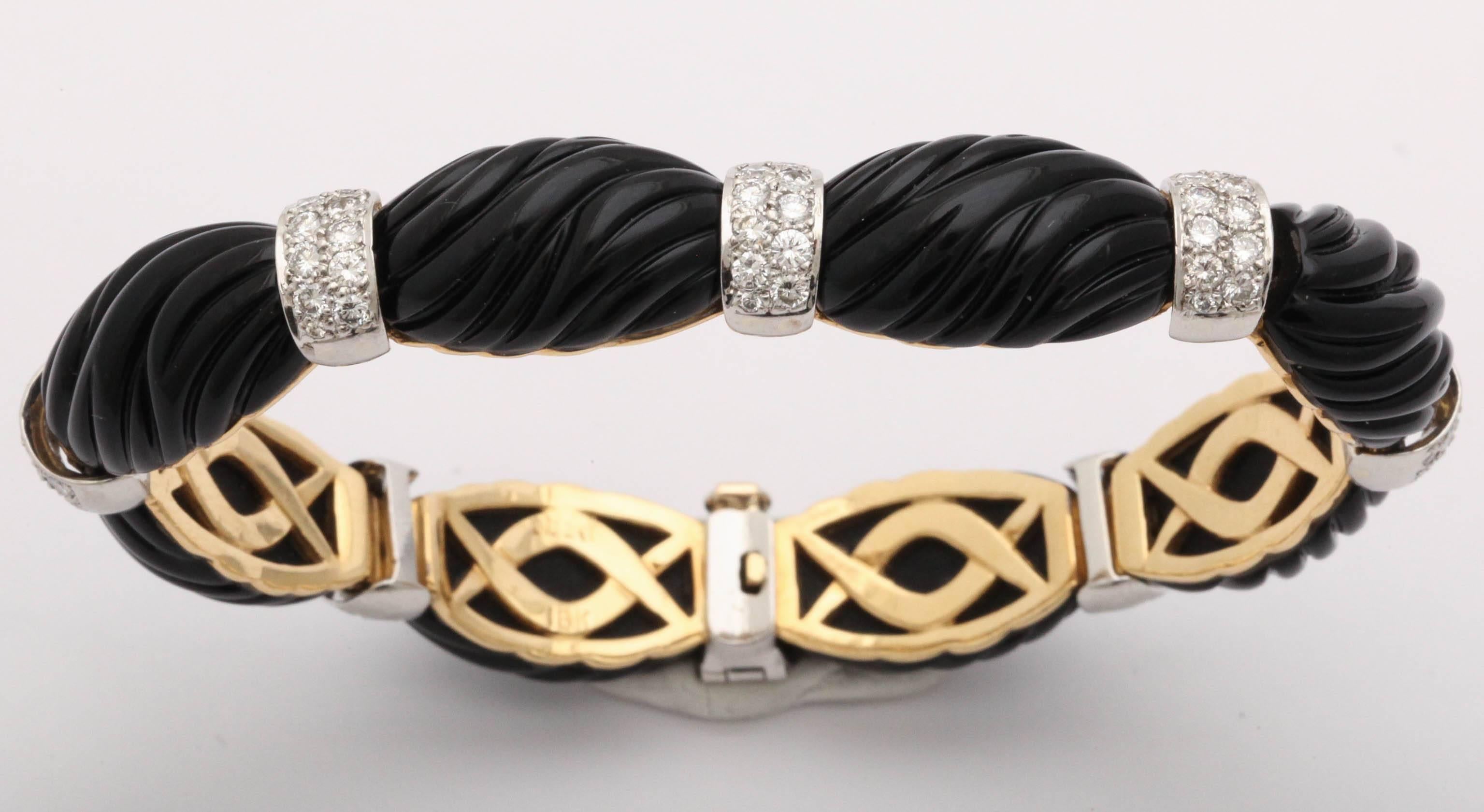Carved Black Onyx Segments set in 18t Yellow Gold and separated by Pave set Diamonds.  Set in 18t Yellow Gold & signed Turi