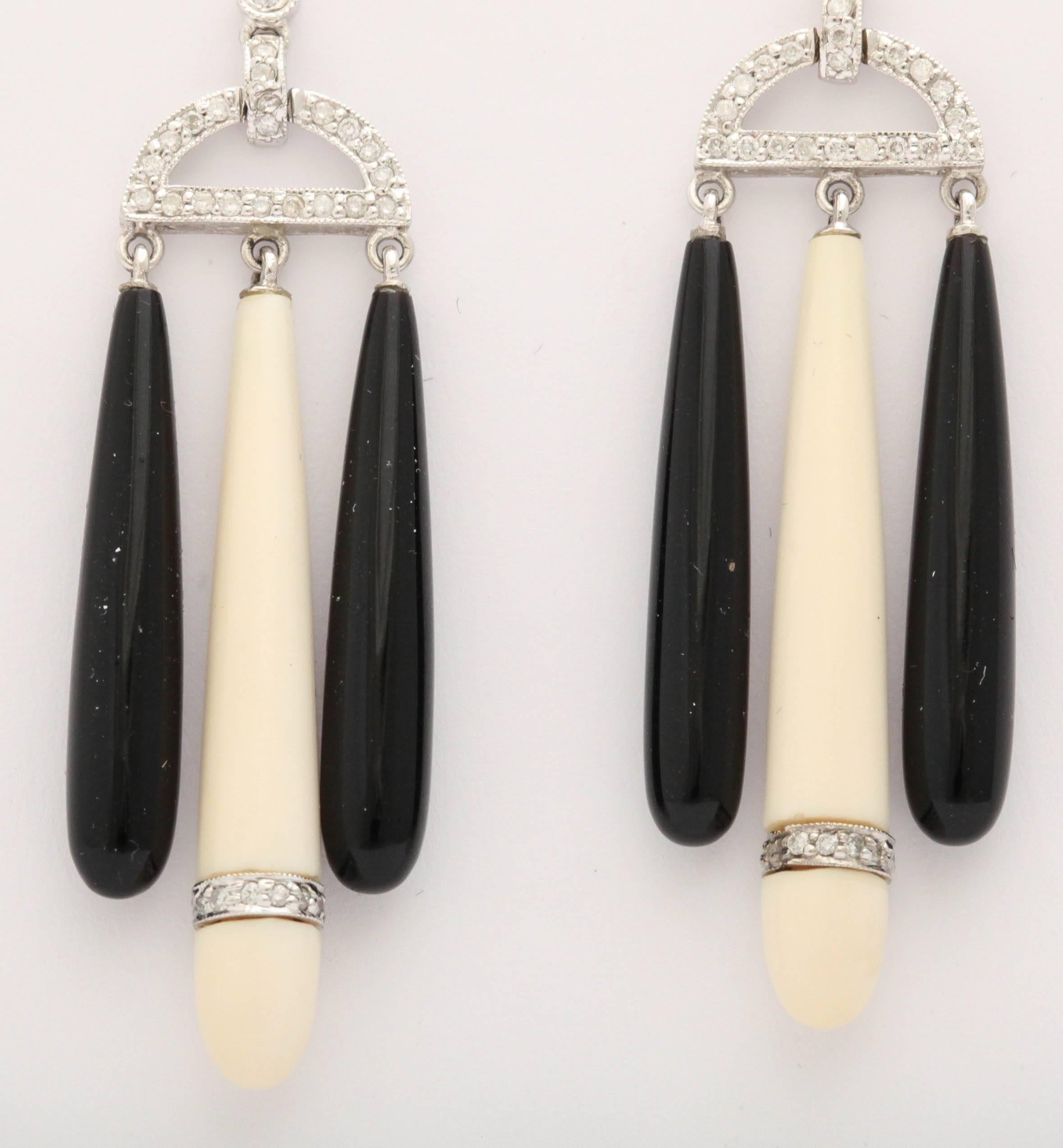 18kt White Gold Pendant Earrings suspended with Black Onyx & White Coral  Drops.  So sexy -  Interspersed with Pave & Bezel set Diamonds  approximately 2 carats total. Accented by faceted Rubies.  So hot!