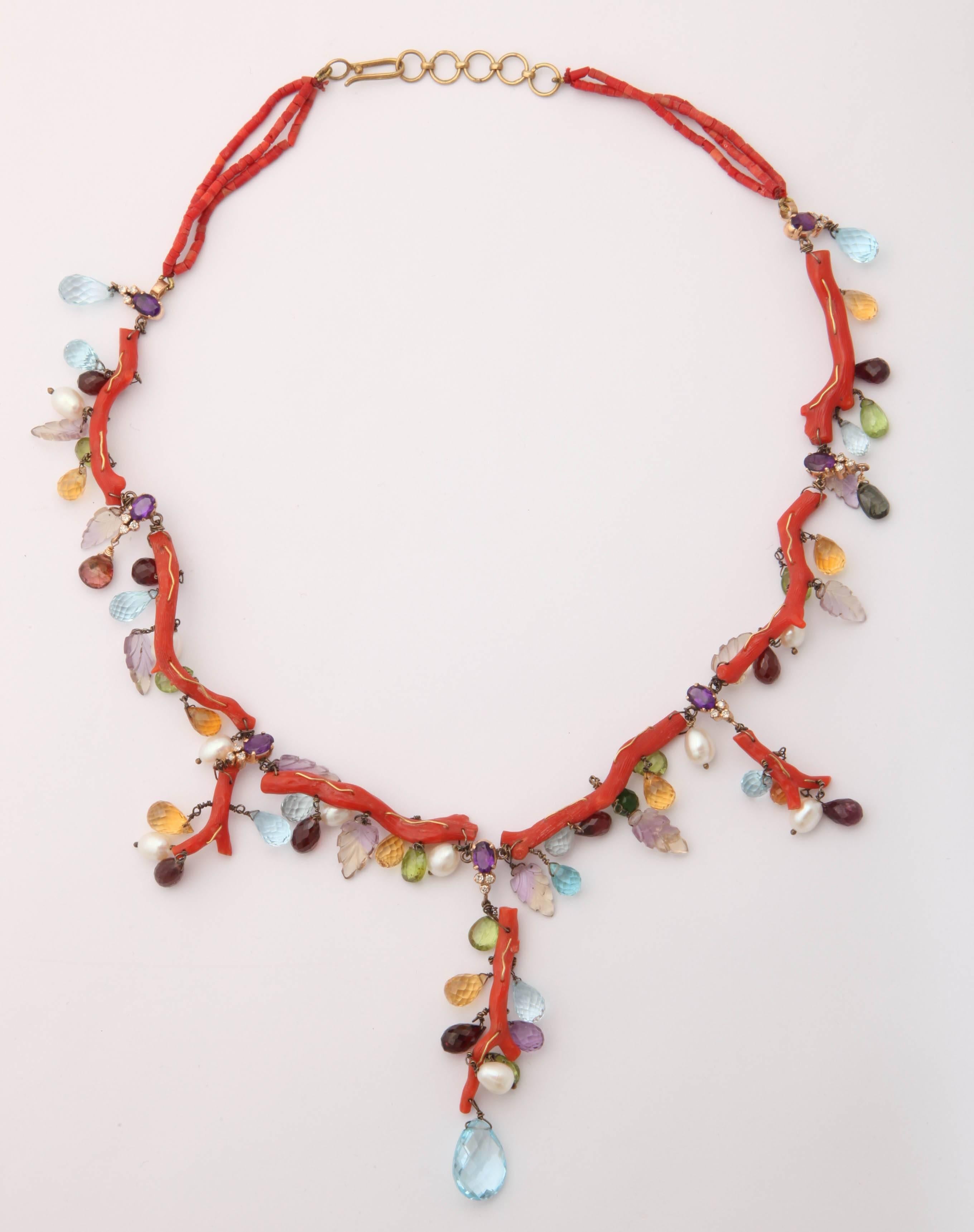 This very unusual coral necklace has everything but the kitchen sink in it. Pearls, all manner of semi precious stone, too many to list, carved leaves, faceted amethyst and diamonds. The necklace is 17 in. long and can be made longer if required.