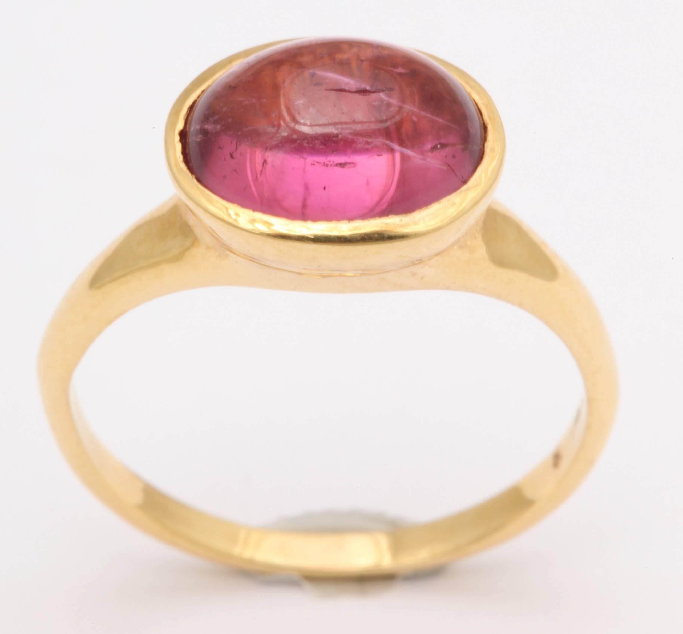 Elegantly simple, this ring has an ancient look. The candy pink tourmaline cab is 8 X 10 mm with a high dome .It is a size 7 and can be made any size.