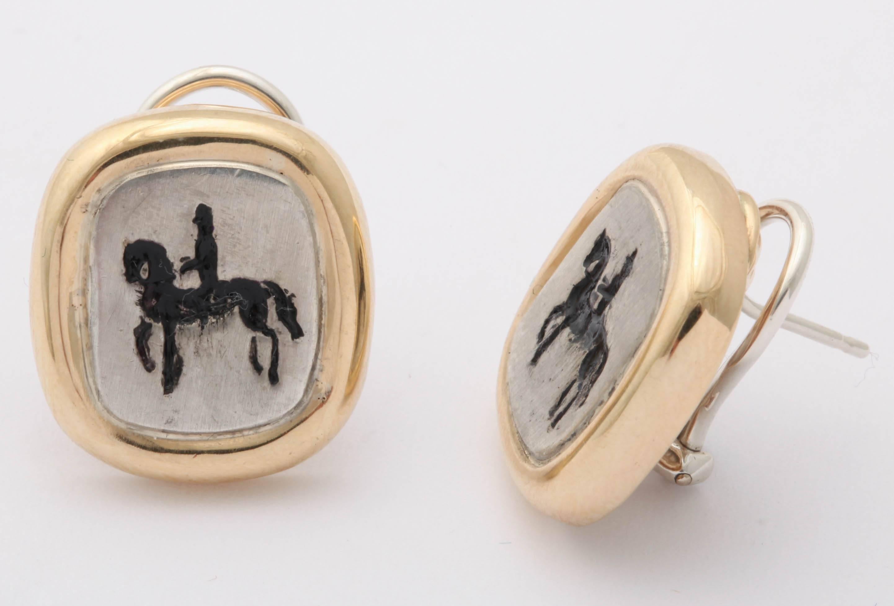 The horse and rider are engraved into the silver and oxidized for contrast. The style of riding can be dressage, Andalusian, or any other equestrian discipline where the horse prances as though it were dancing. The surround is 18 kt yellow gold and