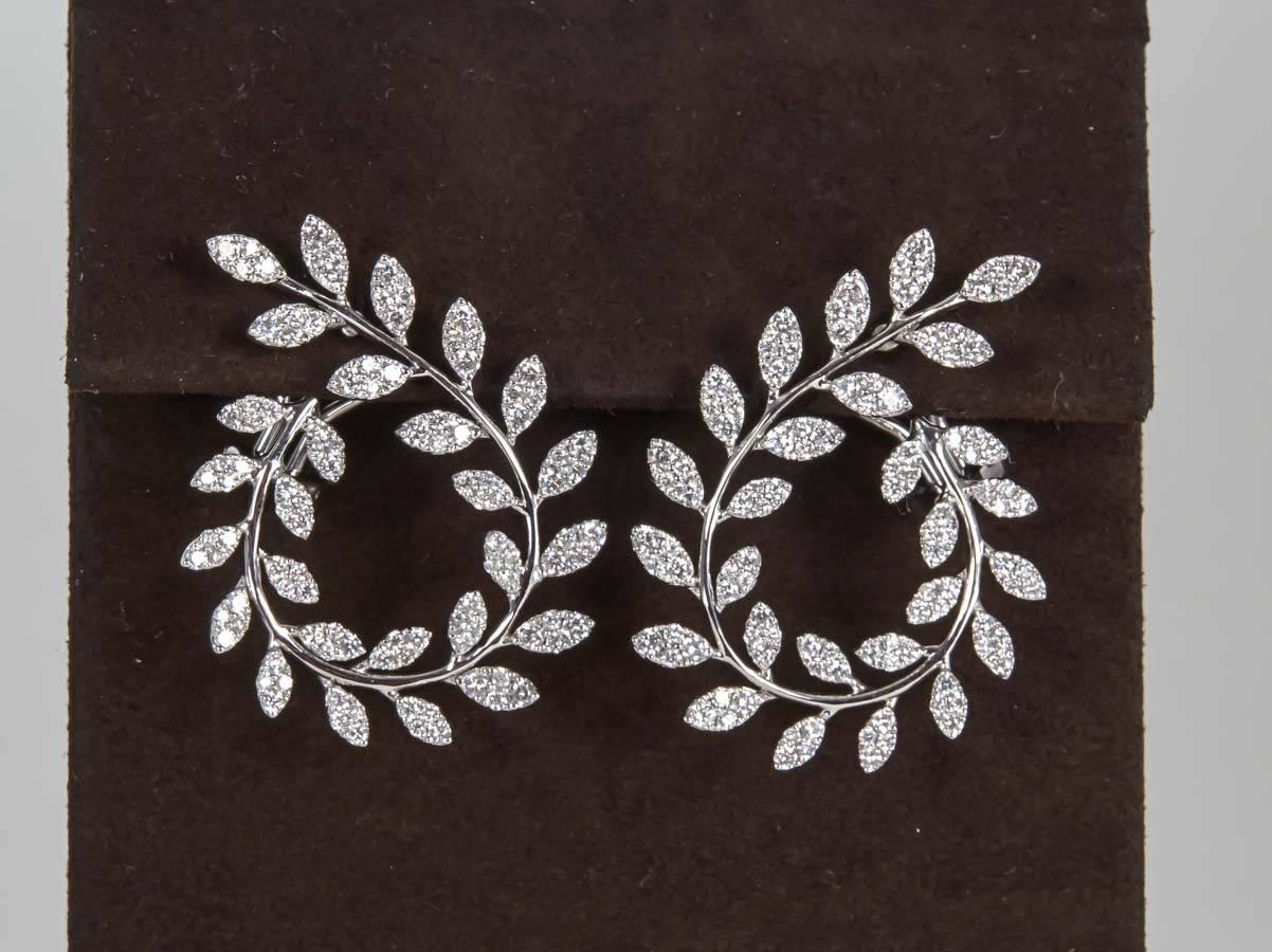 Round Cut Fabulous Diamond Gold Swirl Earrings For Sale
