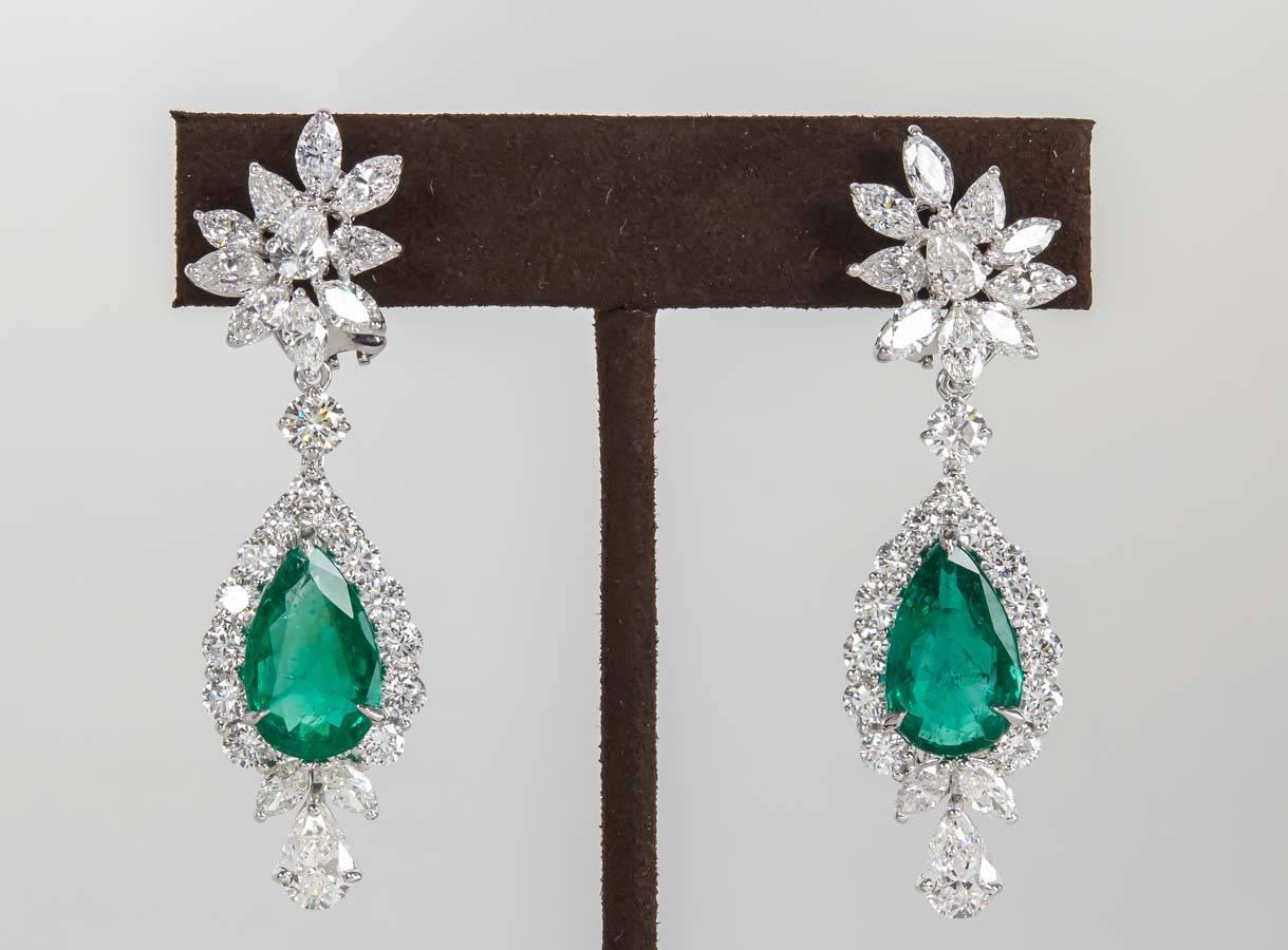 

A breathtaking pair of Fine Green Emerald and Diamond Earrings.

11.55 carats of vibrant green emerald pear shapes

12.26 carats of white VS round brilliant, pear and marquise cut diamonds. 

Handmade in Platinum.

*The emerald and
