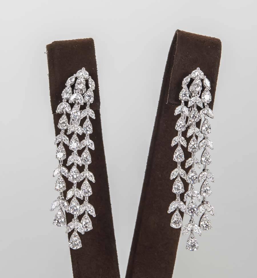 

A stunning pair of earrings in a timeless design.

8.34 carats of round brilliant and marquise cut diamonds set in 18k white gold. 

The diamonds are of the highest quality FG color VS clarity.

Approximately 2.25 inches in length.

The round