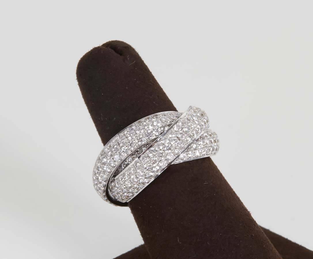 

6.74 carats of white of white FG color round brilliant cut diamonds set in 18k white gold.

This ring will fit a size 6.5 - 7 finger. 