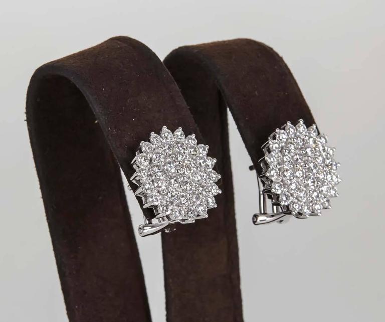 

A FABULOUS pair of earrings -- the perfect size with a ton of SPARKLE!

2.39 carats of white F color VS clarity round brilliant cut diamonds set in 18k white gold.

The earrings measure half an inch in diameter.

These earrings are a must have!