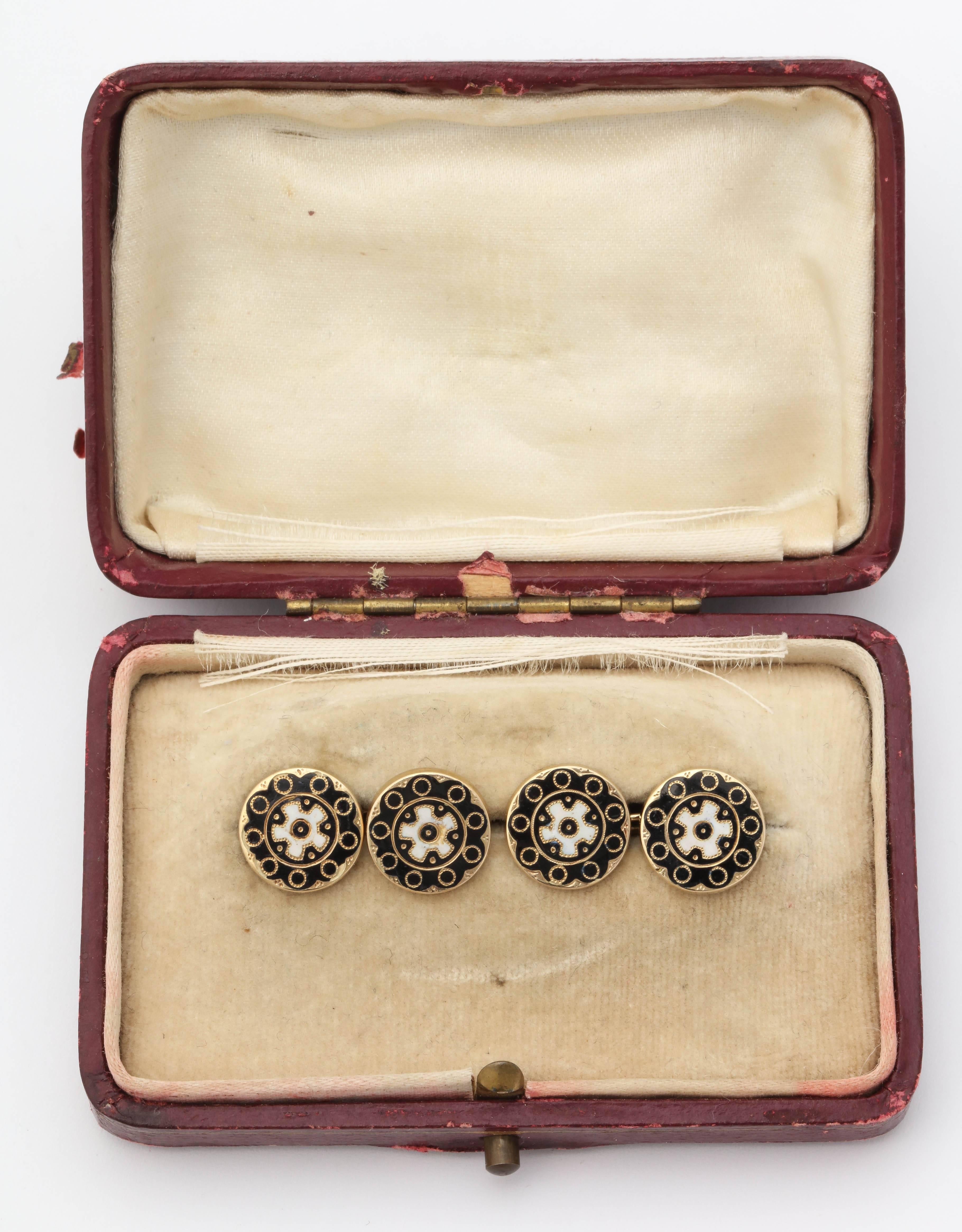 A pair of rare Russian enameled double sided 14k gold cufflinks from the Romanov era, period of Tsar Alexander II, each gold link enameled in black with white cogwheels, attached by oval link chains. 

Mid 19th century, hallmarked 56

Link-1/2 in.