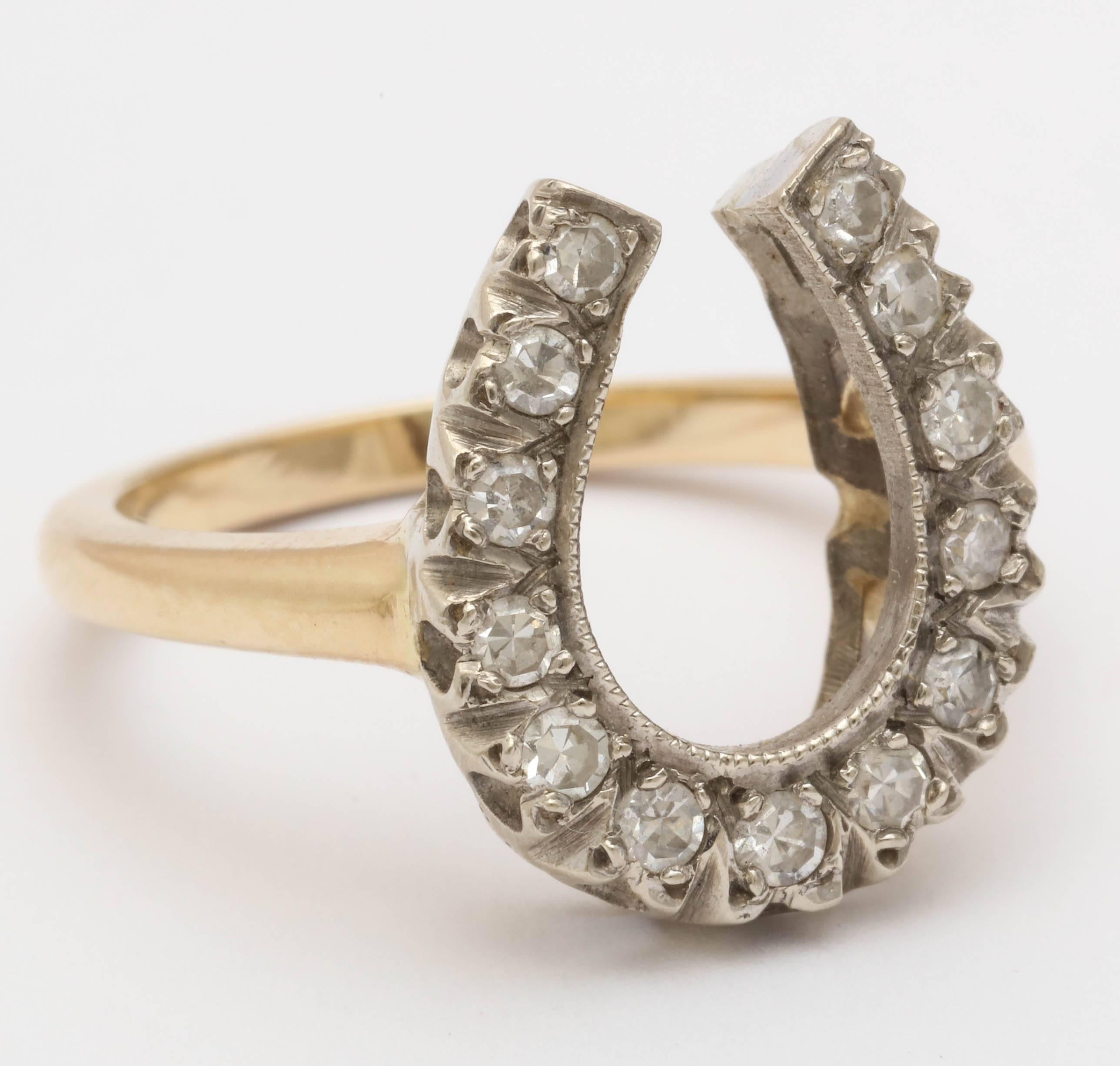 Beautiful silver on 10 karat yellow gold Victorian horseshoe ring. The horse shoe is set with 13 old cut diamonds. 